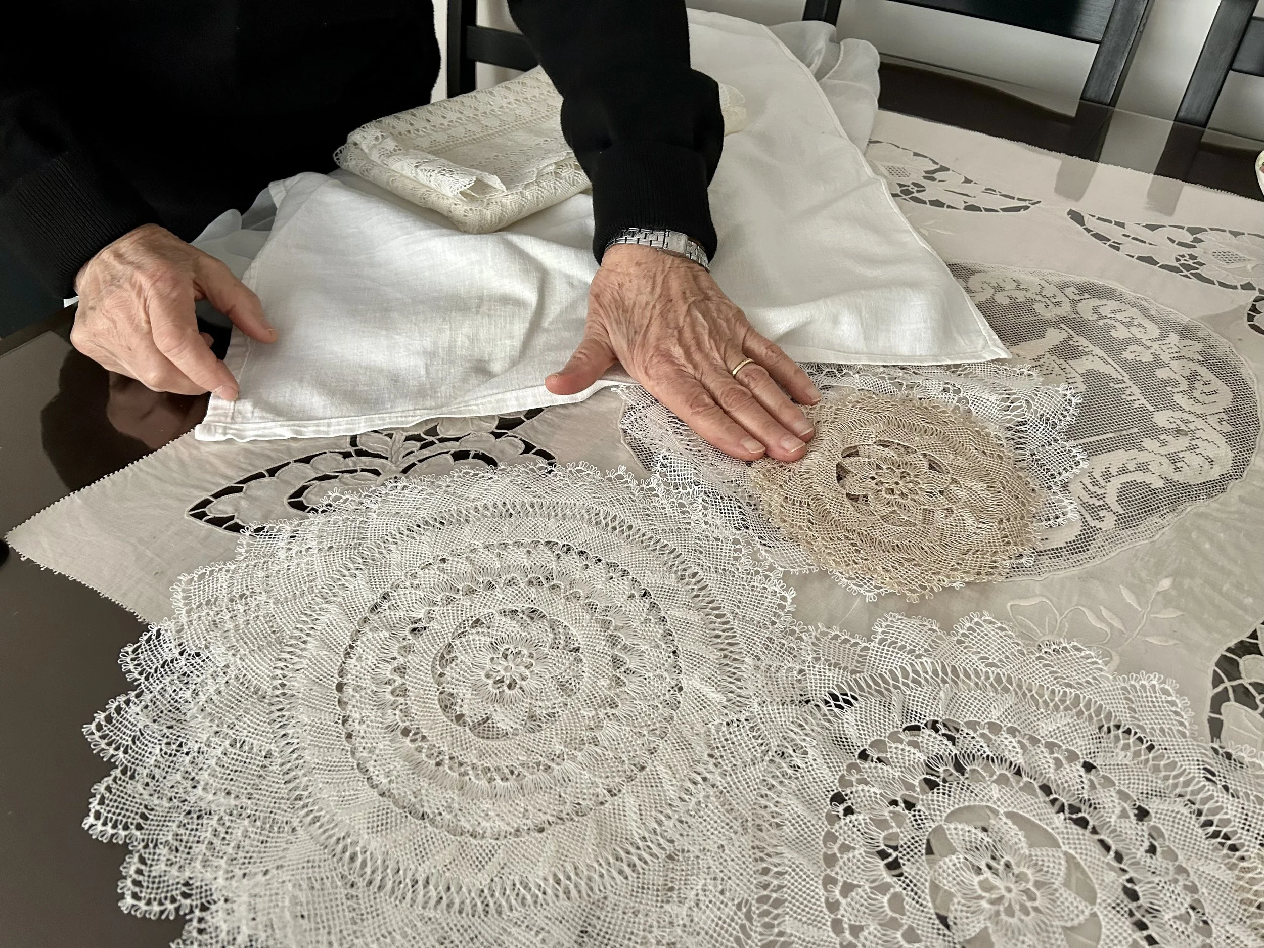 Dzaghig Chitchi displaying her needlelace work, Şişli, Istanbul, Türkiye, 2023. Photo credit: © Deborah Valoma 2023.