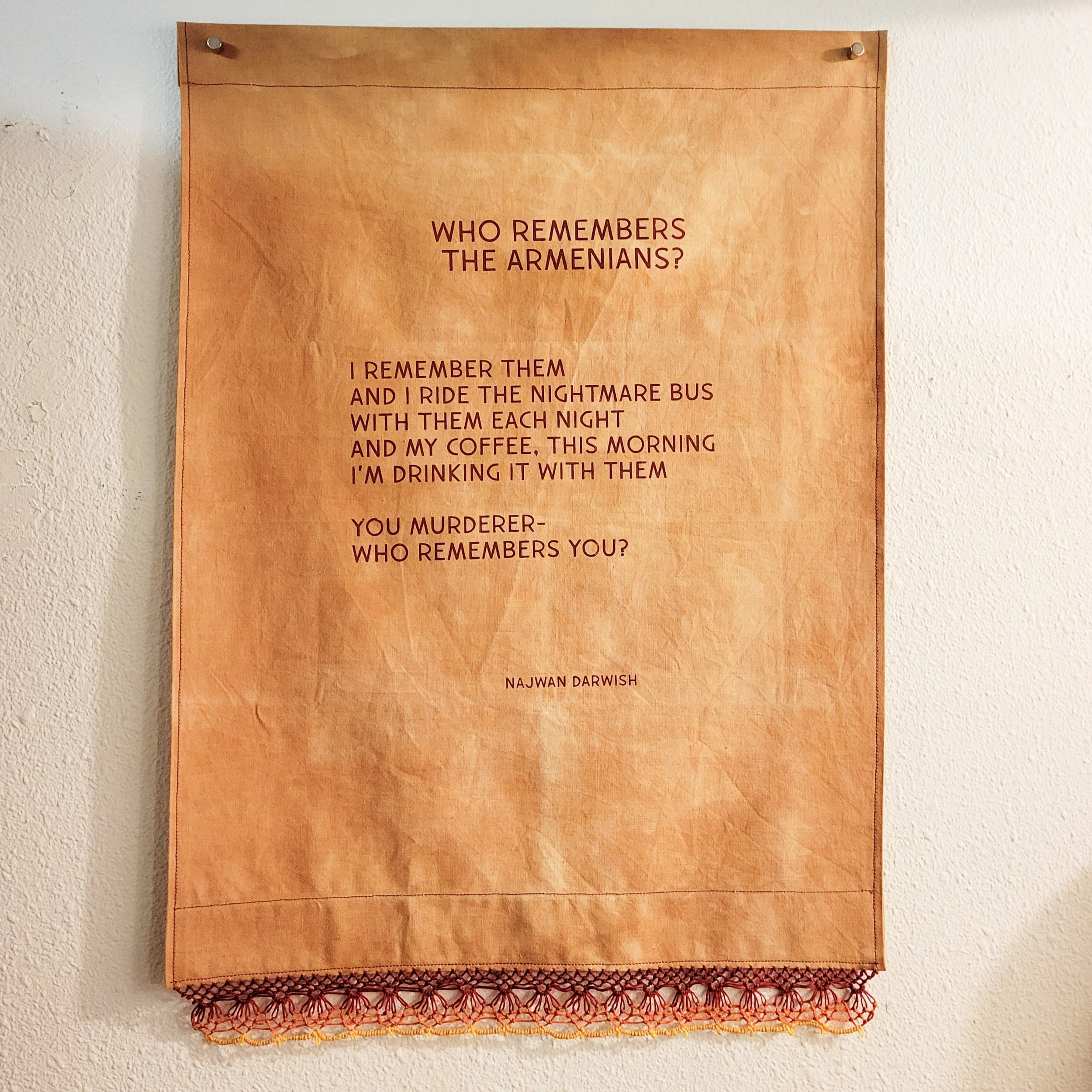Ali Cat,  Who Remembers , screenprint on fabric with lace trim, cotton and linen thread, Portland, Oregon, 2023. Here, Palestinian poet Najwan Darwish asks, "Who Remembers the Armenians"—which inspired Sophia Armen's poem (see related image)—is a res