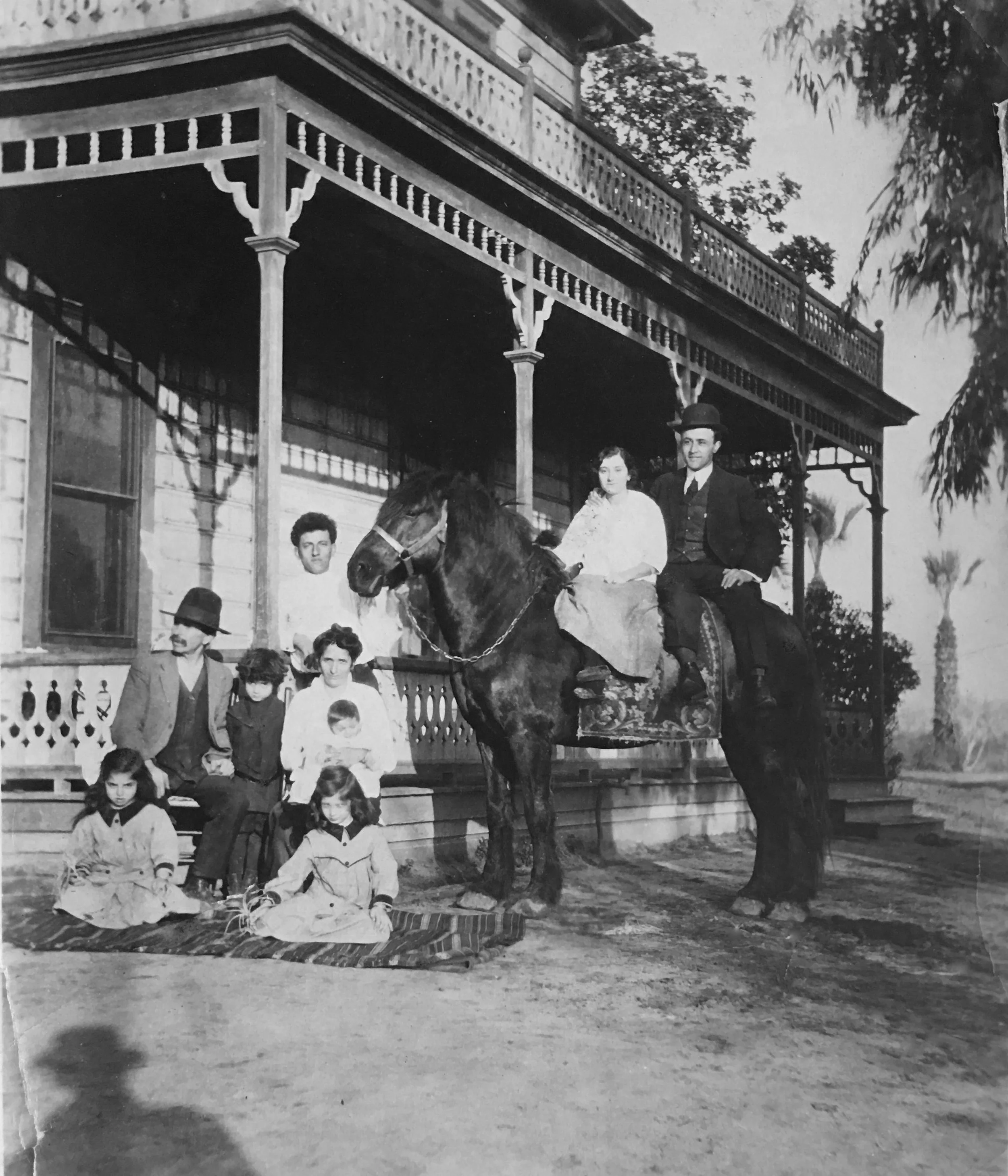 Sohigian farm, Fresno Colony, California, ca. 1915. Margrit Varteresian Sohigian is seated in the center, with her first-born daughter—Deborah's grandmother Sara—seated in front of her. Both were expert needleworkers, including needlelace. Photo: © D