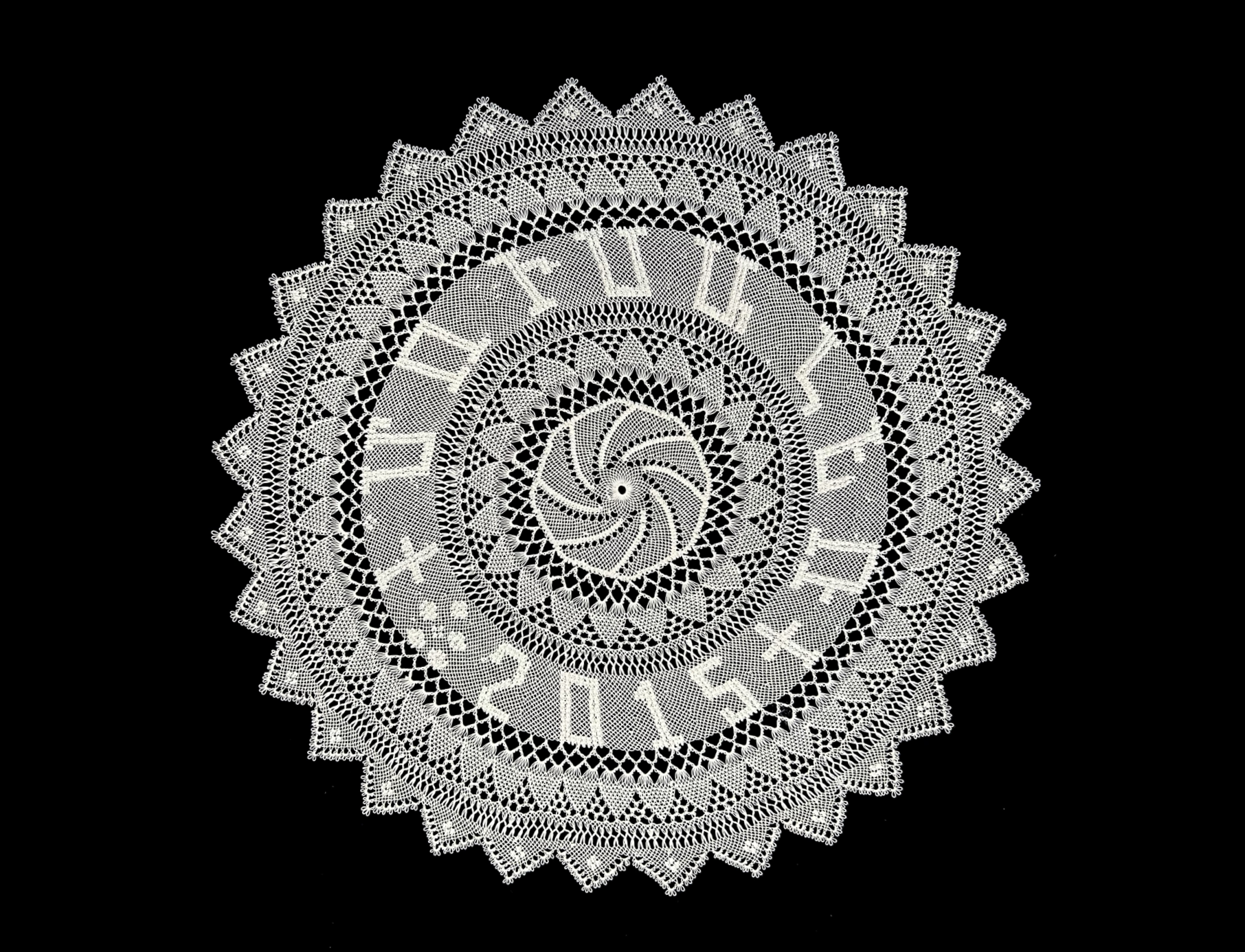 Color photo of Armenian needlelace doily with Armenian letters stitched in