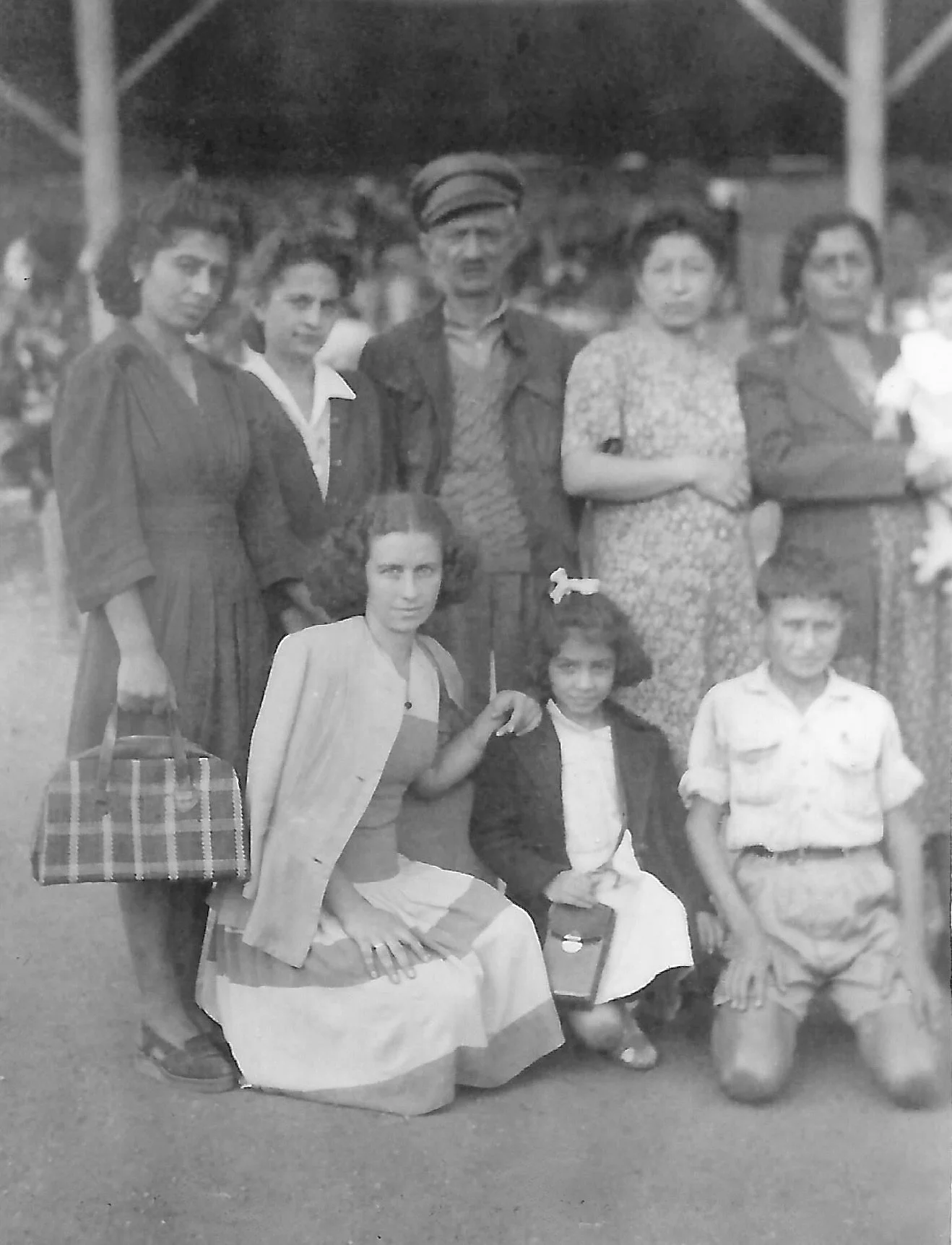 Elise Youssoufian’s great-grandmother Ovsanna Dedeian (née Chaparian, far right, holding Elise’s then-infant mother) with her second husband (center), five daughters, and two of her grandchildren (far right), Beirut, 1947. Ovsanna and her eldest daug