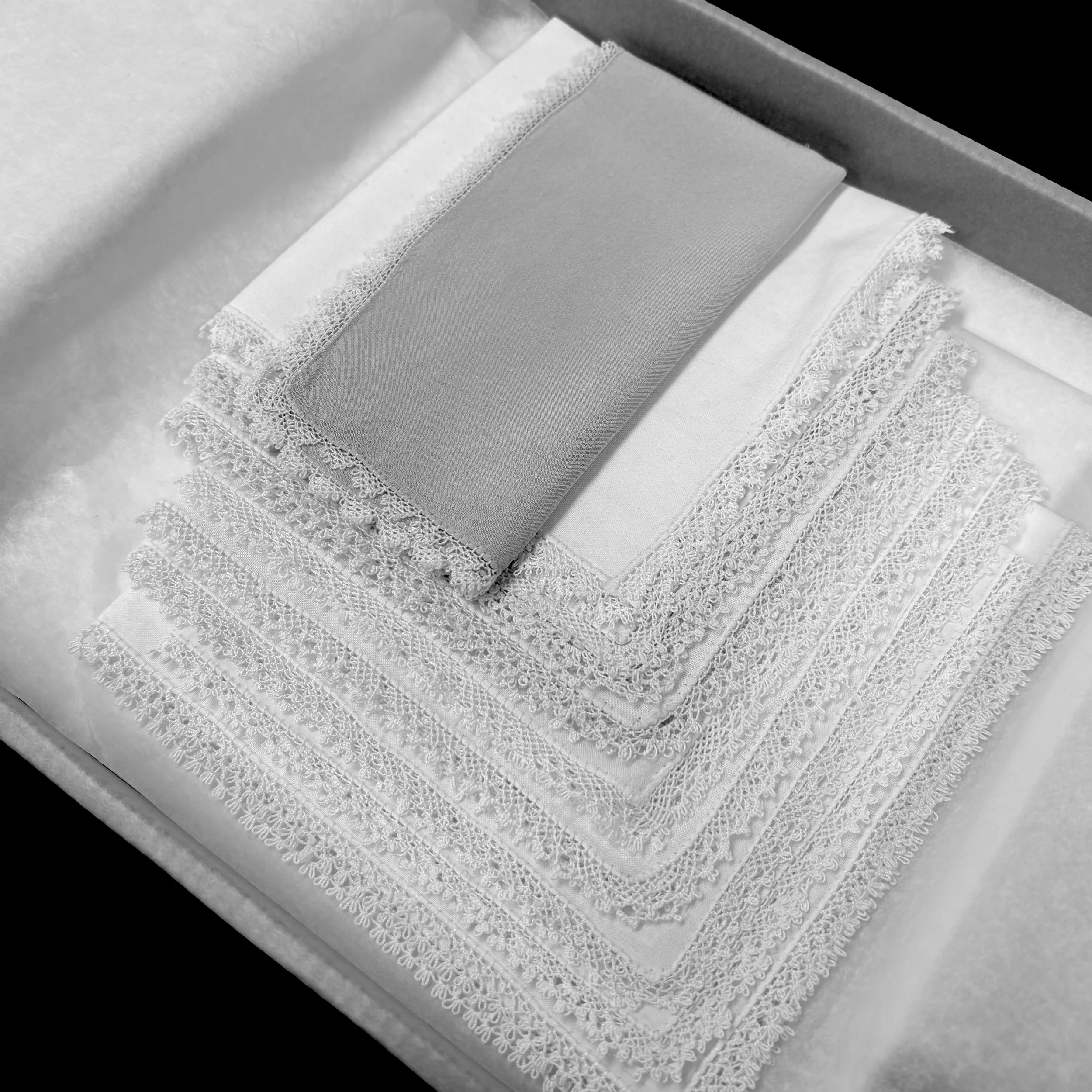 Black and white photo of textiles archive storage