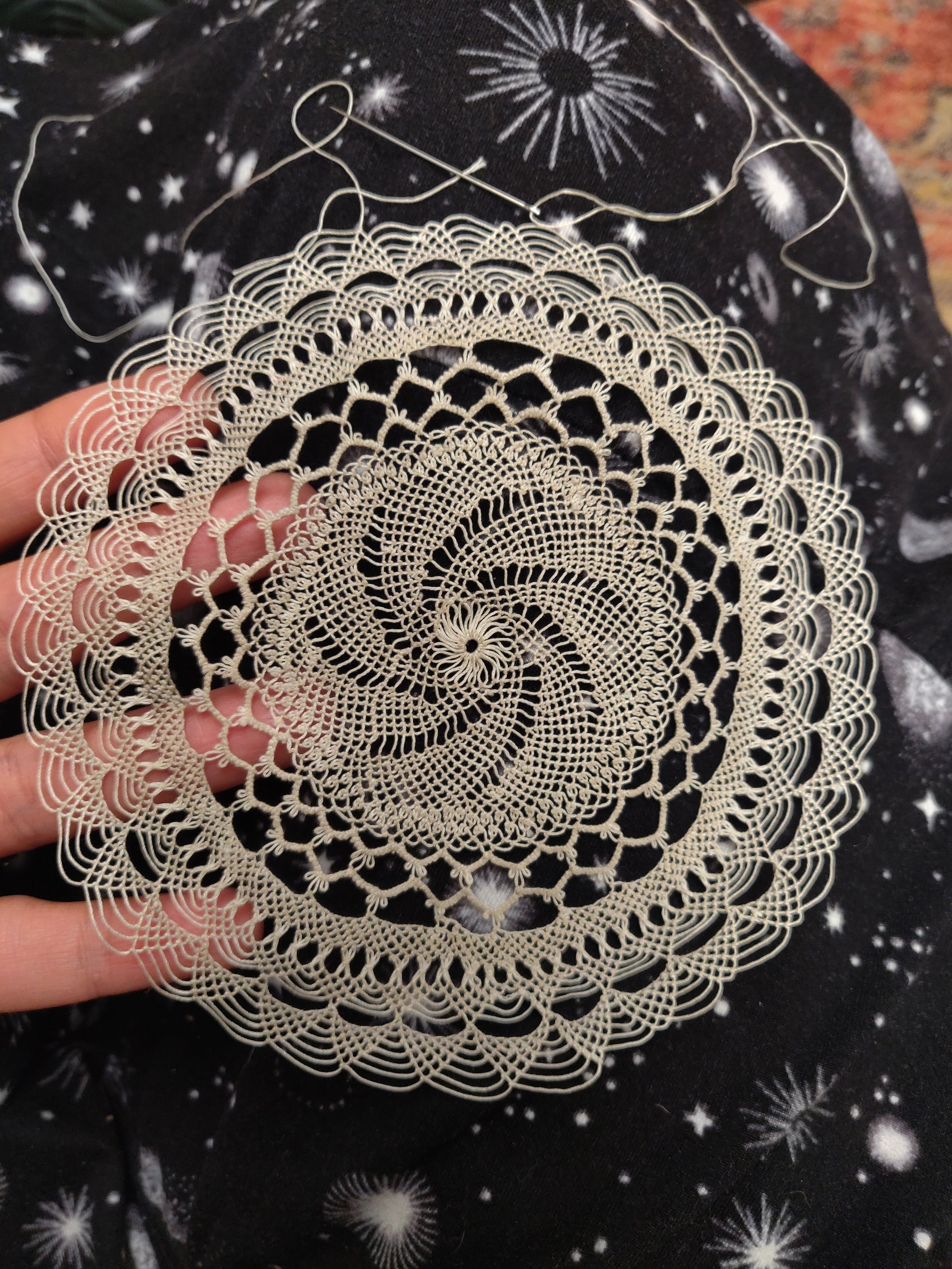 Elise Youssoufian,  Cosmos , 2025. Armenian needlelace doily in progress. With a symbol of eternity and Elise's matrilineal lands holding its center, this piece began during the traditional Blessing of the Grapes in the Armenian village of Vakıflı, i