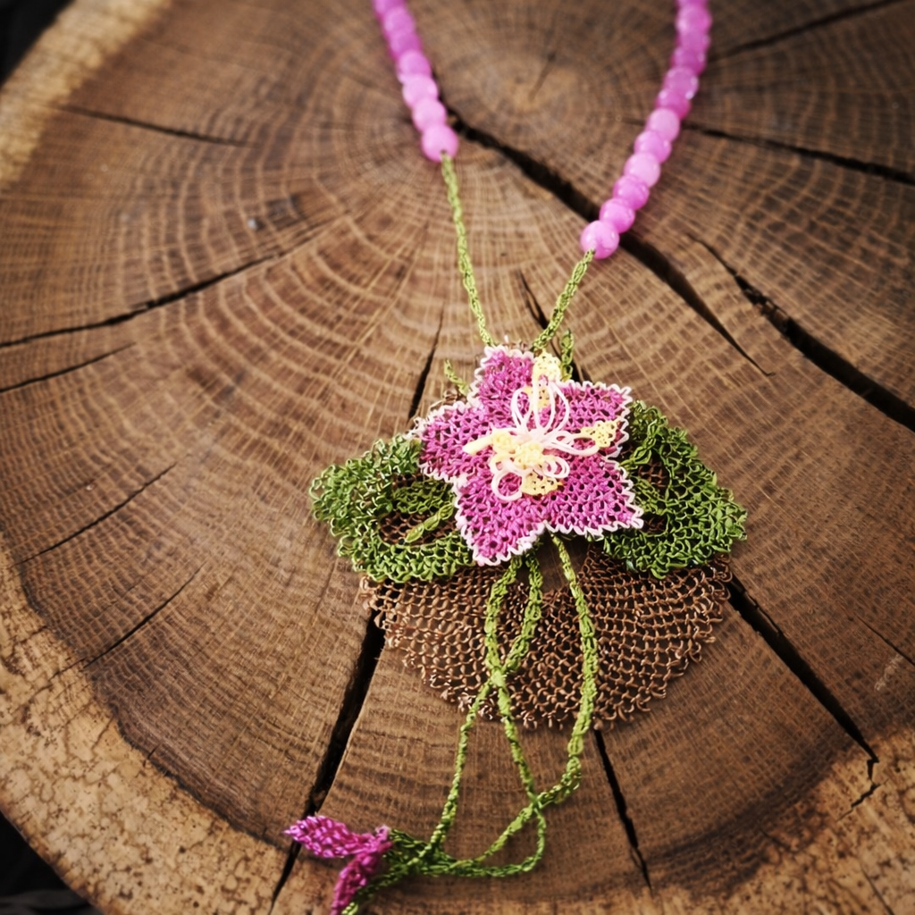 Linda Oral Şener, colorful crocheted and beaded necklace with needlelace pendant, Samandağ, Hatay, Turkey. Photo: © Linda Oral Şener 2026.