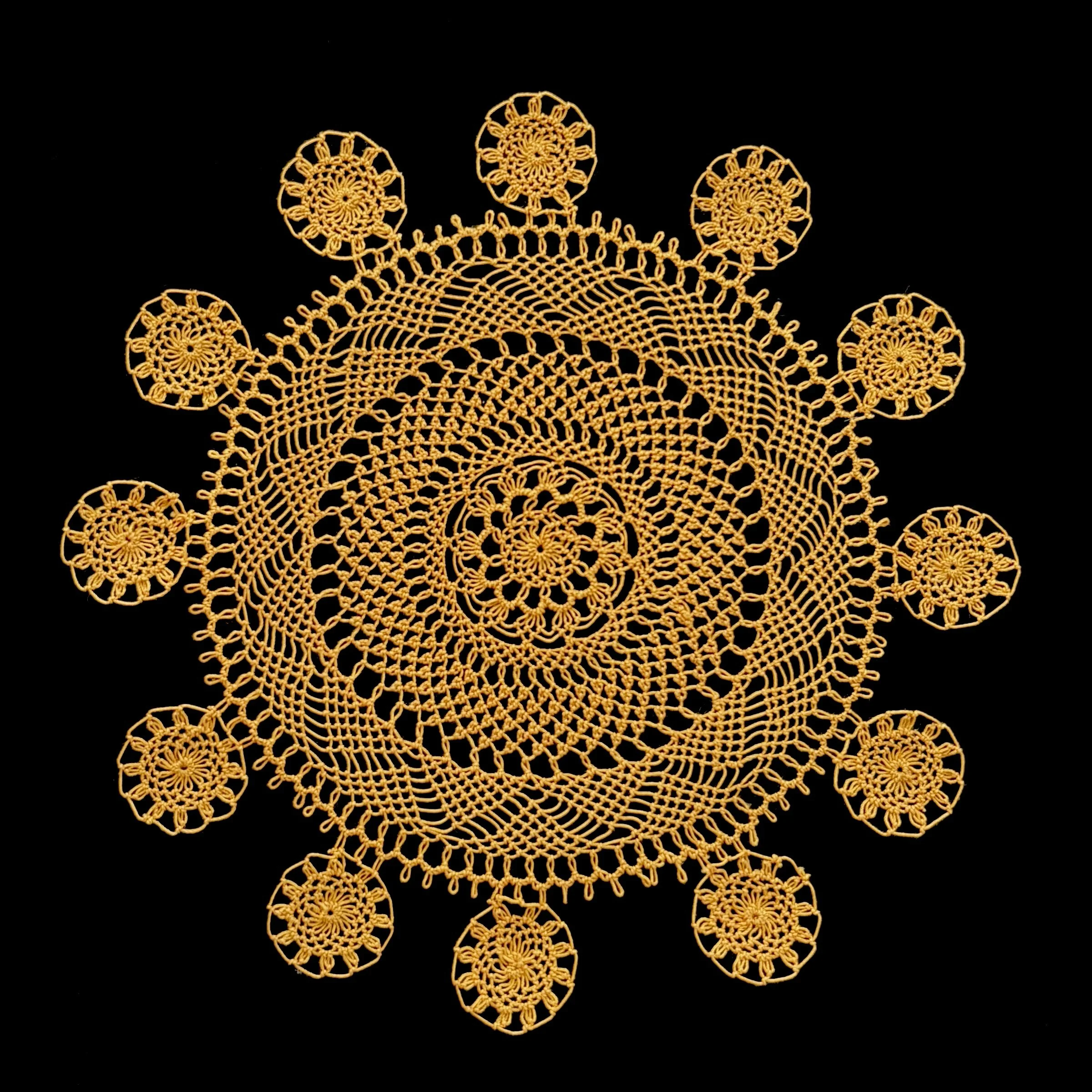 Mikayla Kurkjian, needlelace doily composition of one small doily surrounded by twelve circular medallions, Maryland, 2025. Received the Chesapeake Region Lace Guild Special Award in the 2025 Maryland State Fair. Photo credit: @ Mikayla Kurkjian 2026