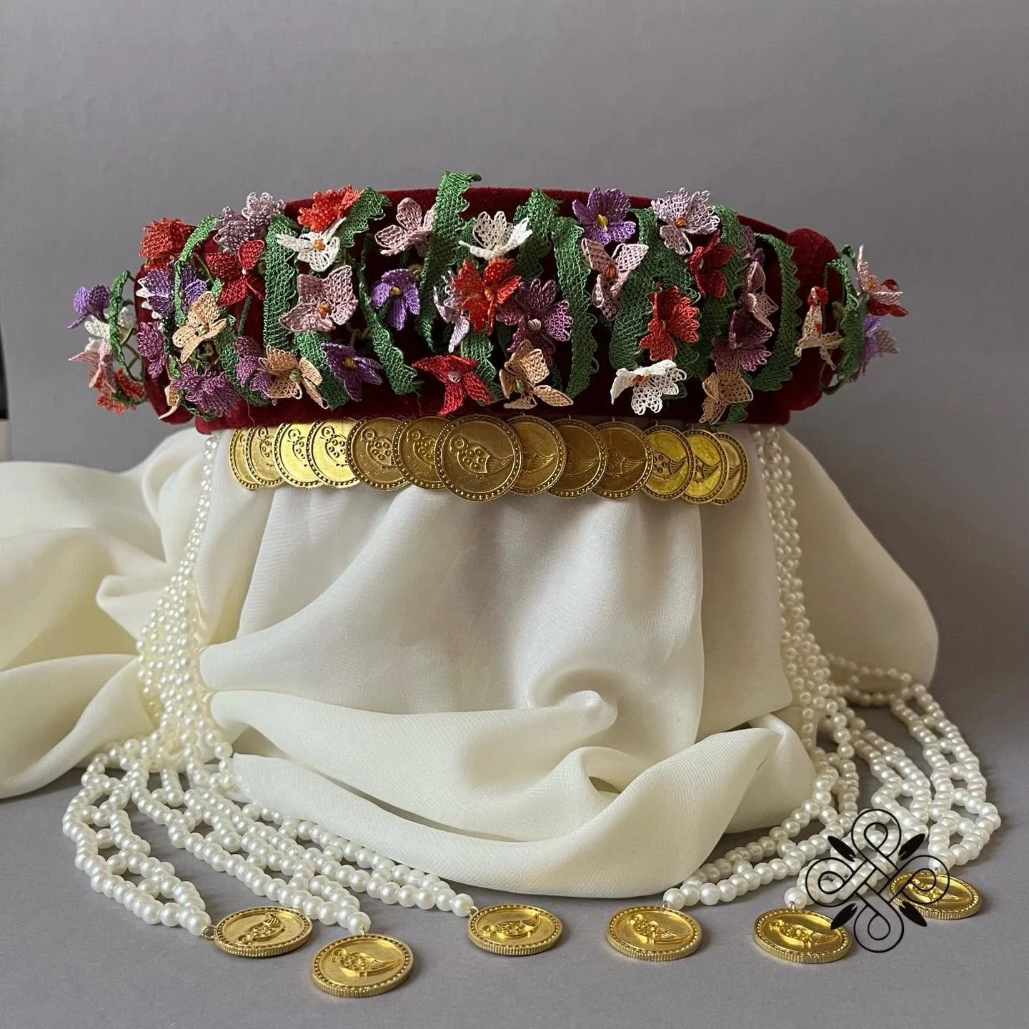 Iskuhi Sargsyan, traditional needlelace headdress with accents of coins and pearl beads, Yerevan, Armenia. Iskuhi Sargsyan, traditional needlelace headdress with accents of coins and pearl beads, Yerevan, Armenia. This is a reproduction of a վարդ-թան