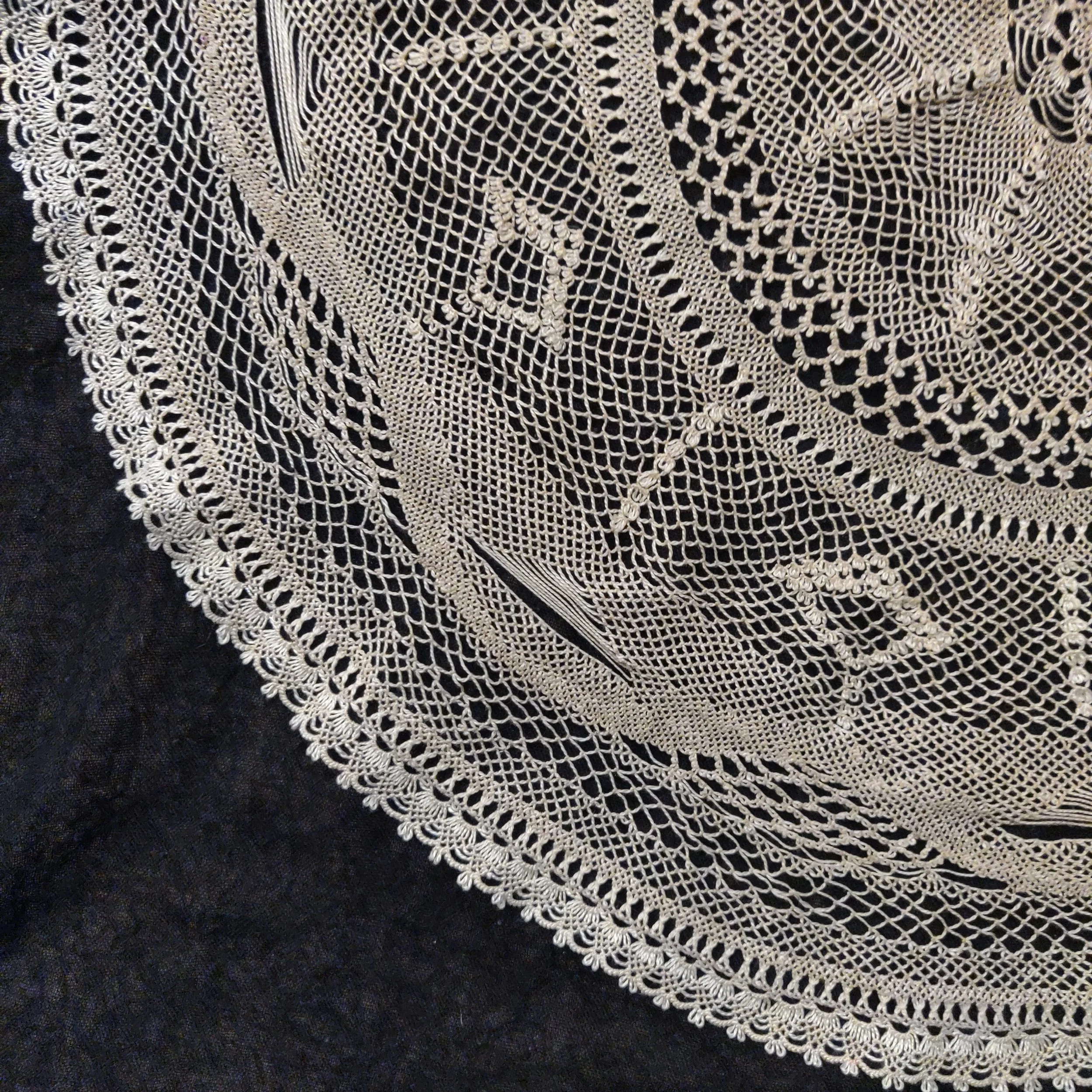 Elise Youssoufian,  Seven Months , 2020-2021. Large needlelace doily. To help Elise stay present amid chaotic intersections of COVID-19, war, and uprisings against injustice, Elise experimented with her then-budding needlelace skills, bringing togeth