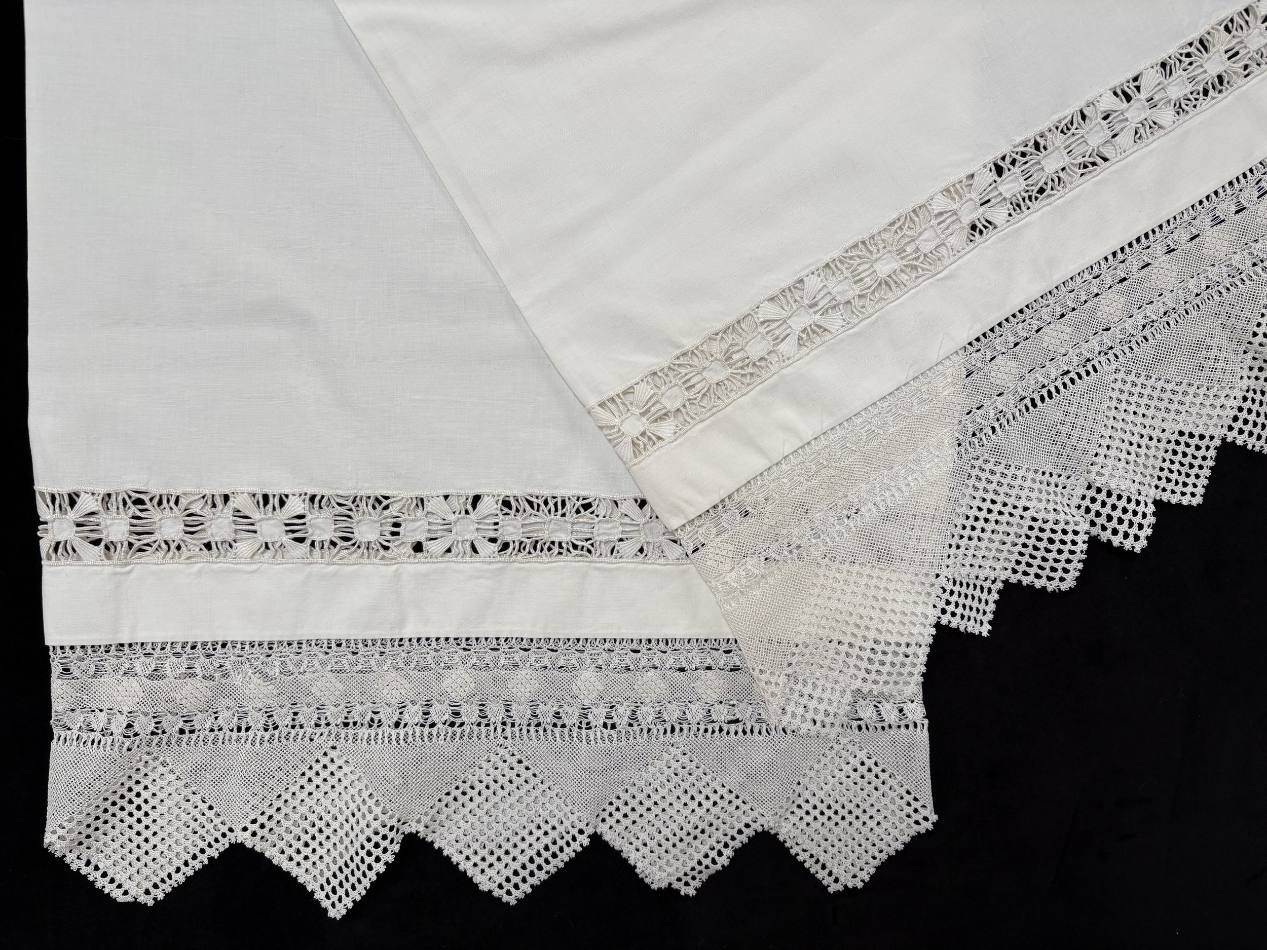 Azadig Bidanian Archive. Martha Tashjian, double pillowcase with needlelace trim and whitework, Anjar, Lebanon, ca. 1950. Made and presented to Azadig's aunt Baidzar on the occasion of her arranged marriage, Anjar, Lebanon, 1950. Given to Azadig by B