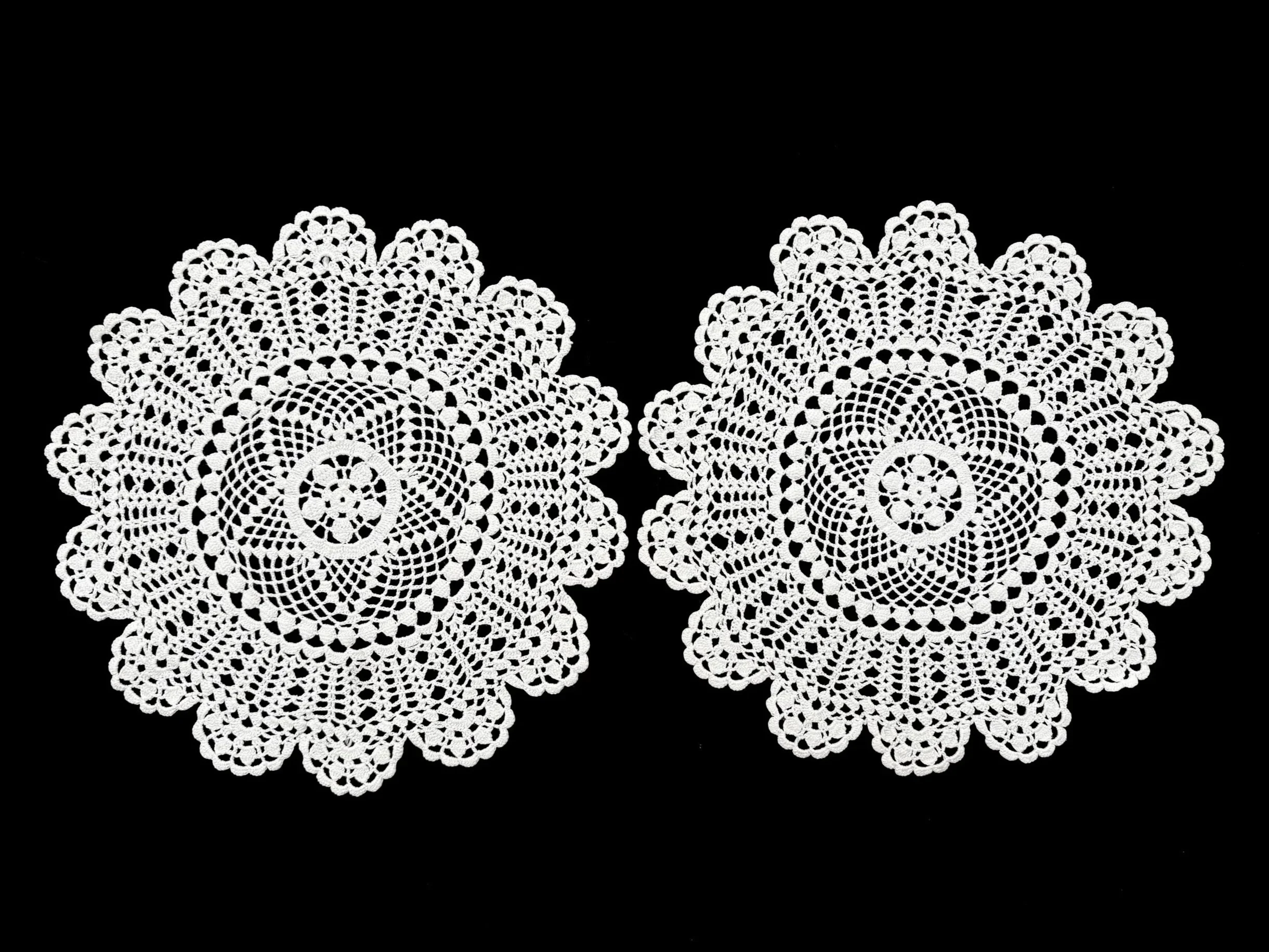 Color photo of twin Armenian crocheted lace doilies