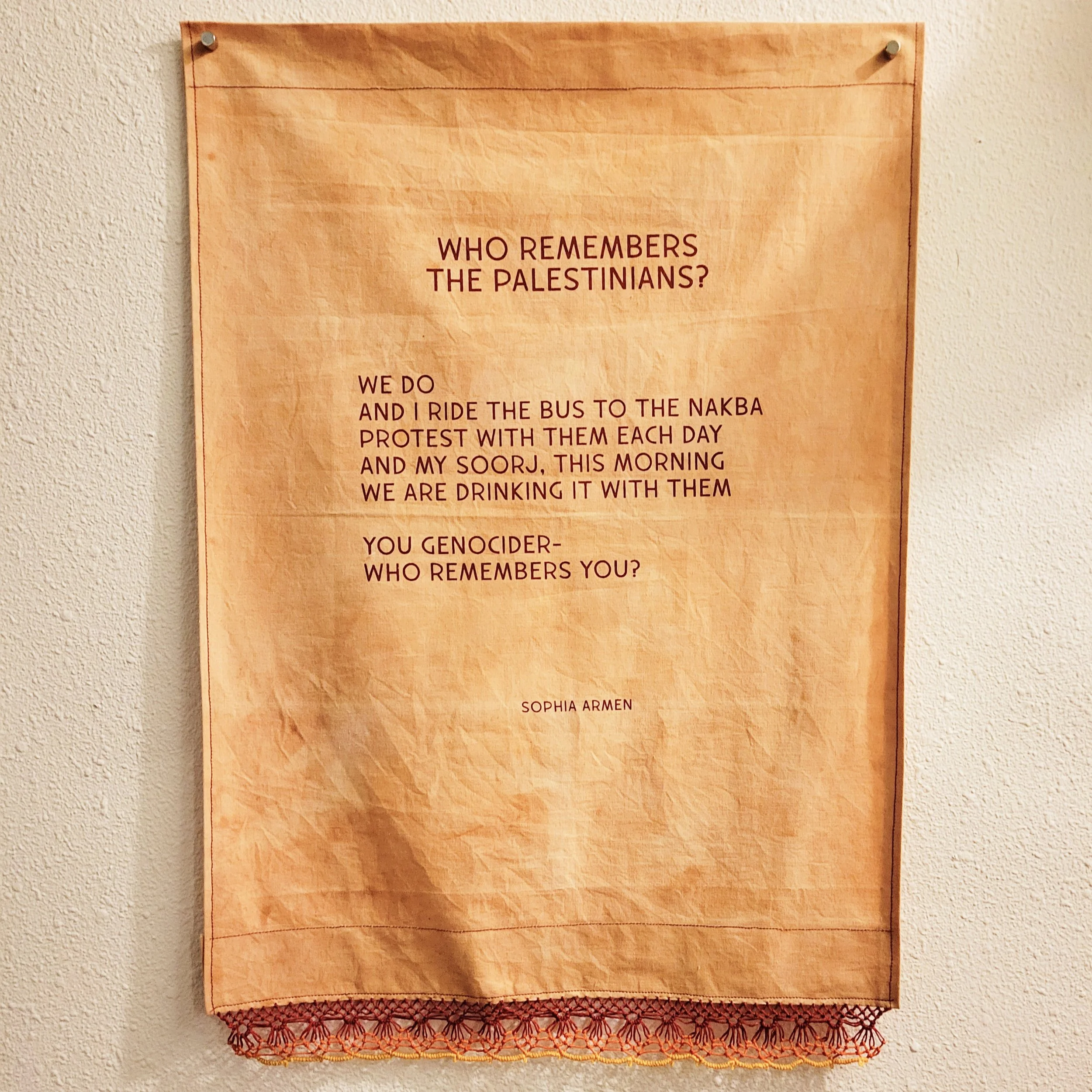 Ali Cat,  Who Remembers , screenprint on fabric with lace trim, cotton and linen thread, Portland, Oregon, 2023. The first SWANA Stitch community show was held just two weeks after the start of the current genocide in Palestine and just three weeks a