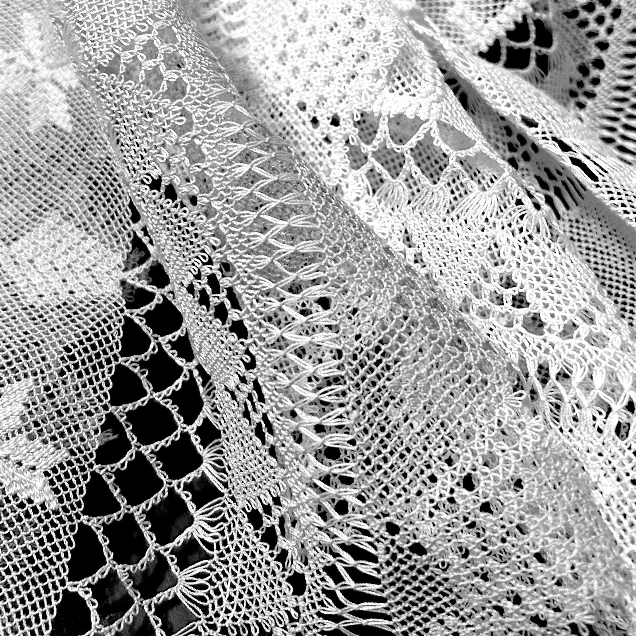 Black and white photo of Armenian needlelace doilies