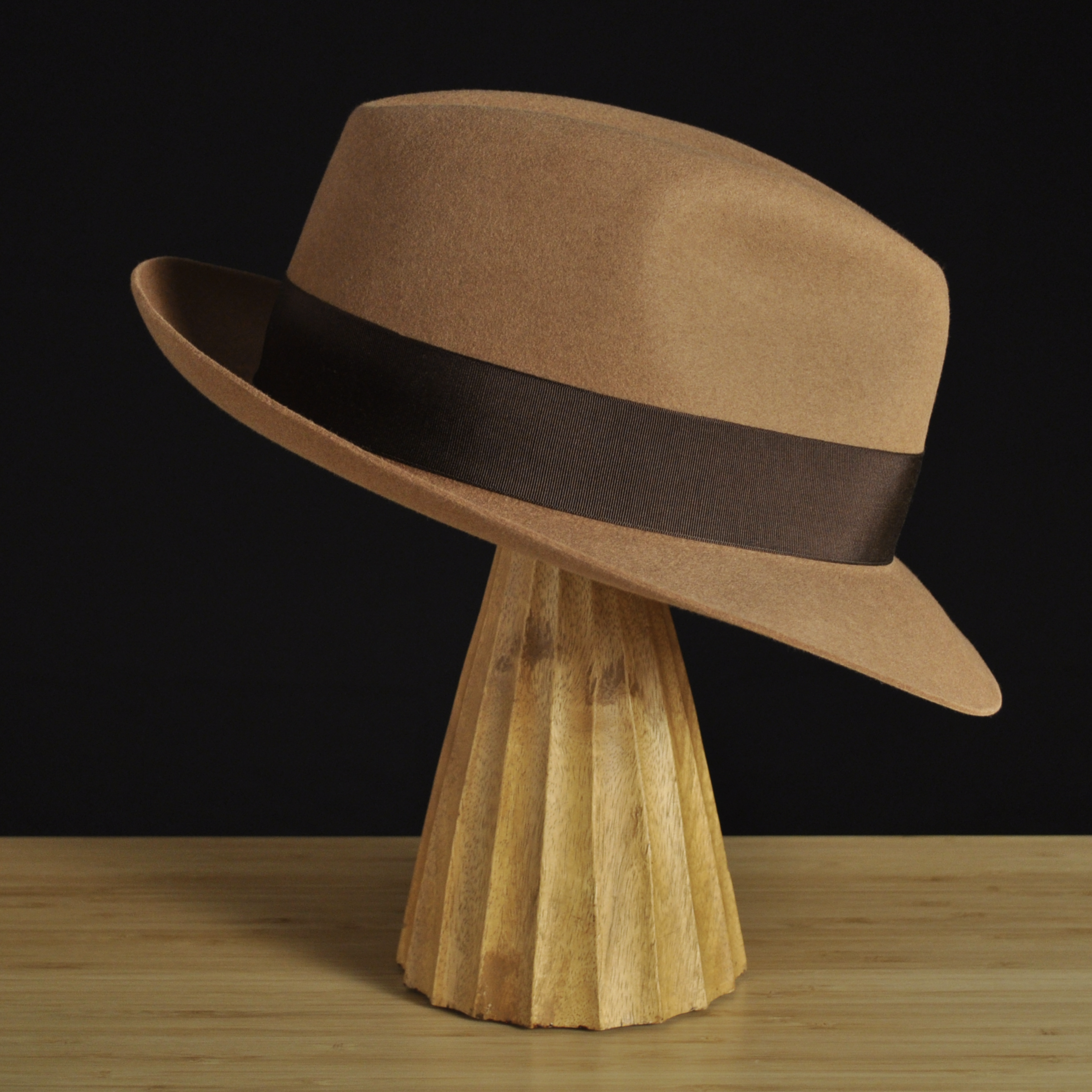 Right view of The Vendômer tan felt fedora with a softly pinched crown, medium snap brim, and dark brown grosgrain ribbon with classic bow.