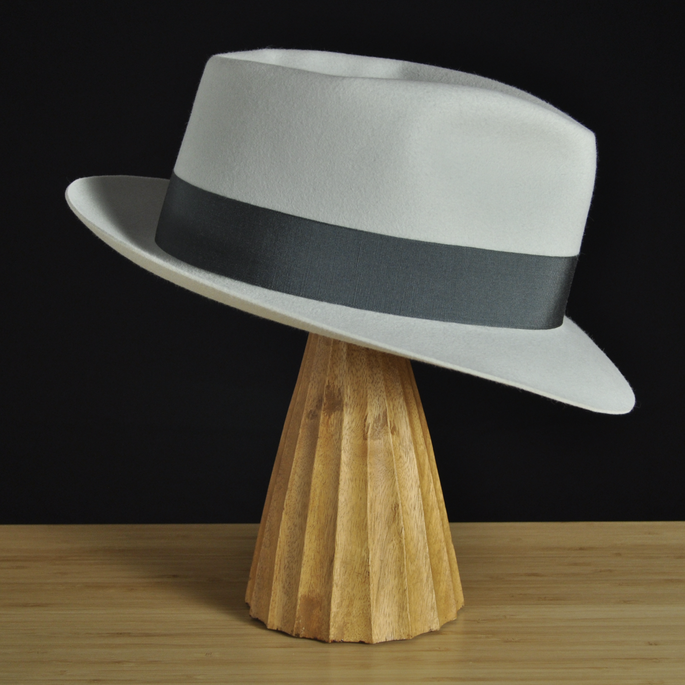 Right view of The Sunsetter silvermist felt fedora with a softly pinched crown, medium snap brim, and contrasting dark grosgrain ribbon with a modern tie (no bow).