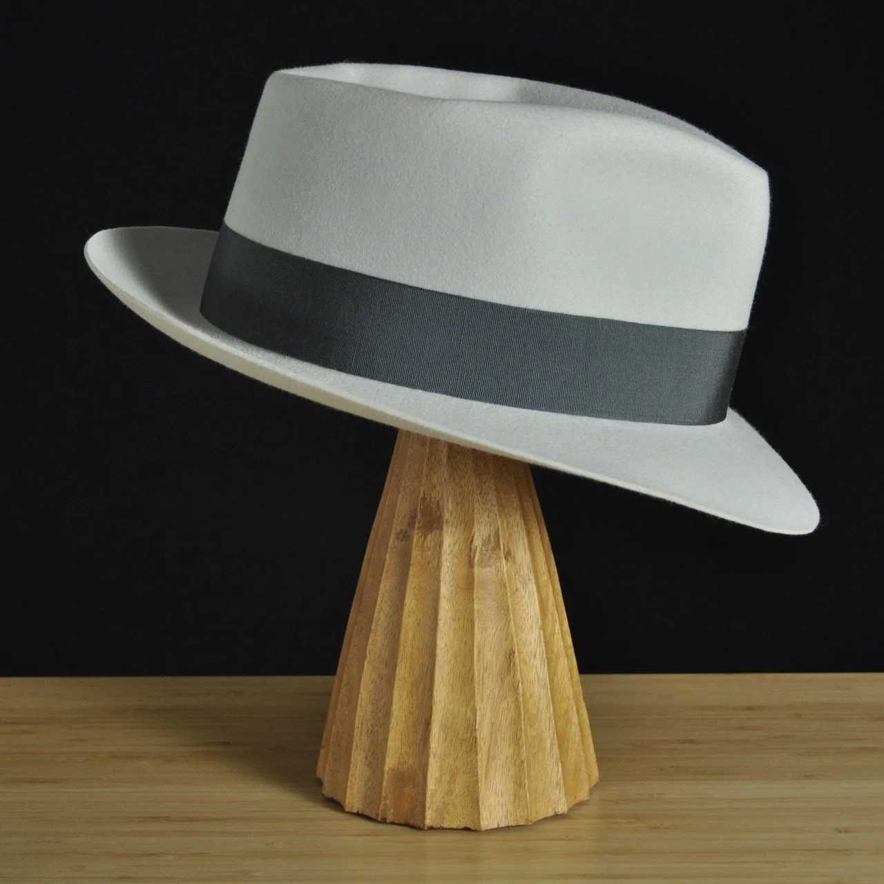 Right view of The Sunsetter silvermist felt fedora with a softly pinched crown, medium snap brim, and contrasting dark grosgrain ribbon with a modern tie (no bow).