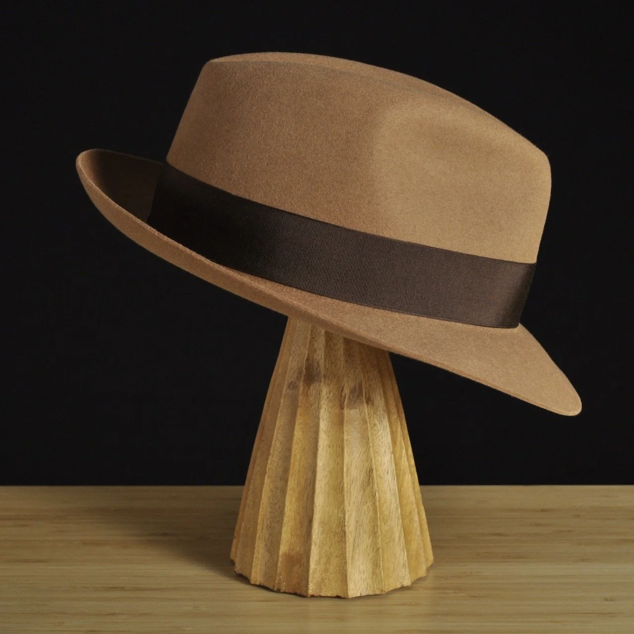 Right view of The Vendômer tan felt fedora with a softly pinched crown, medium snap brim, and dark brown grosgrain ribbon with classic bow.