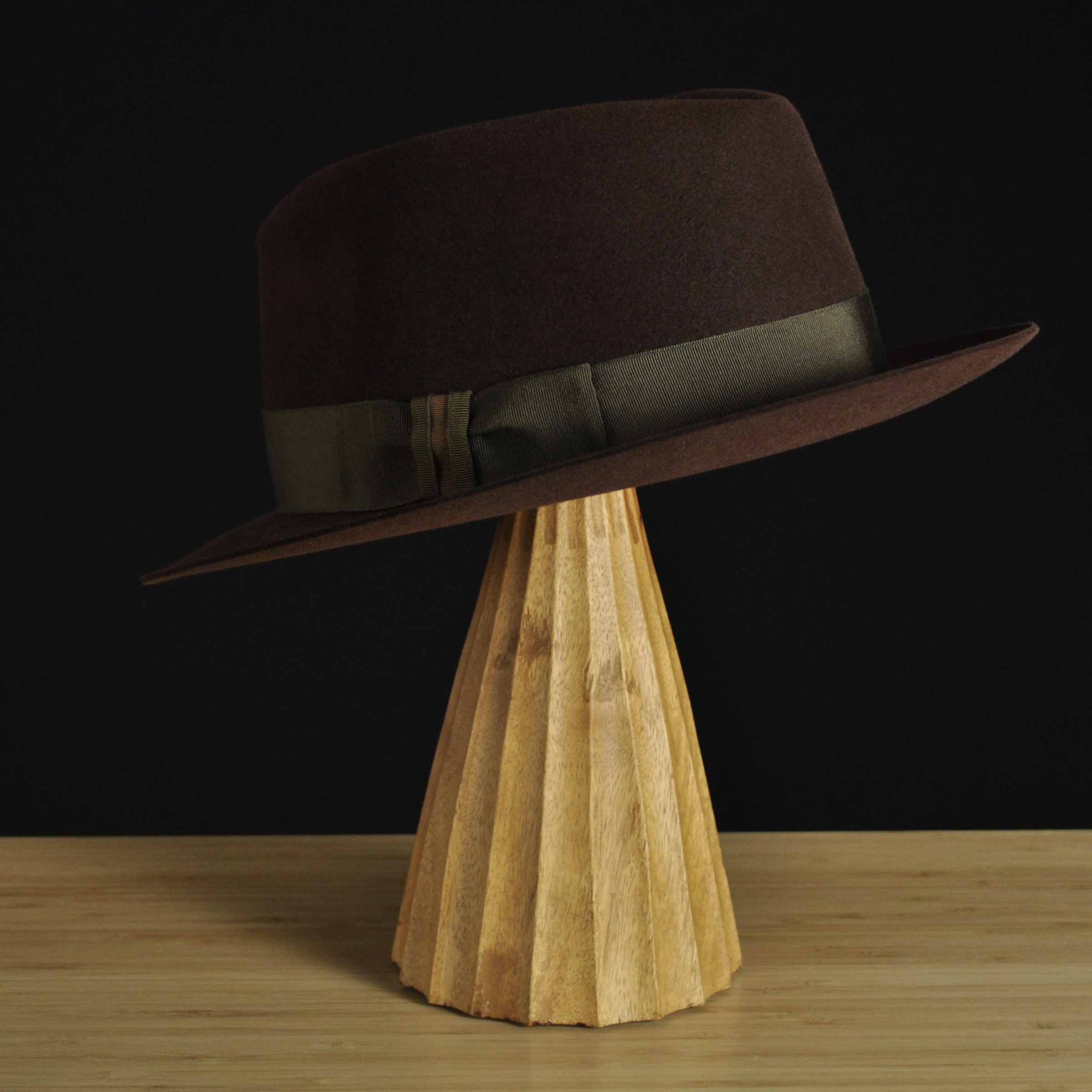 Three quarter back left profile of The Hielander brown felt fedora highlighting the balanced proportions and subtle brim curvature.