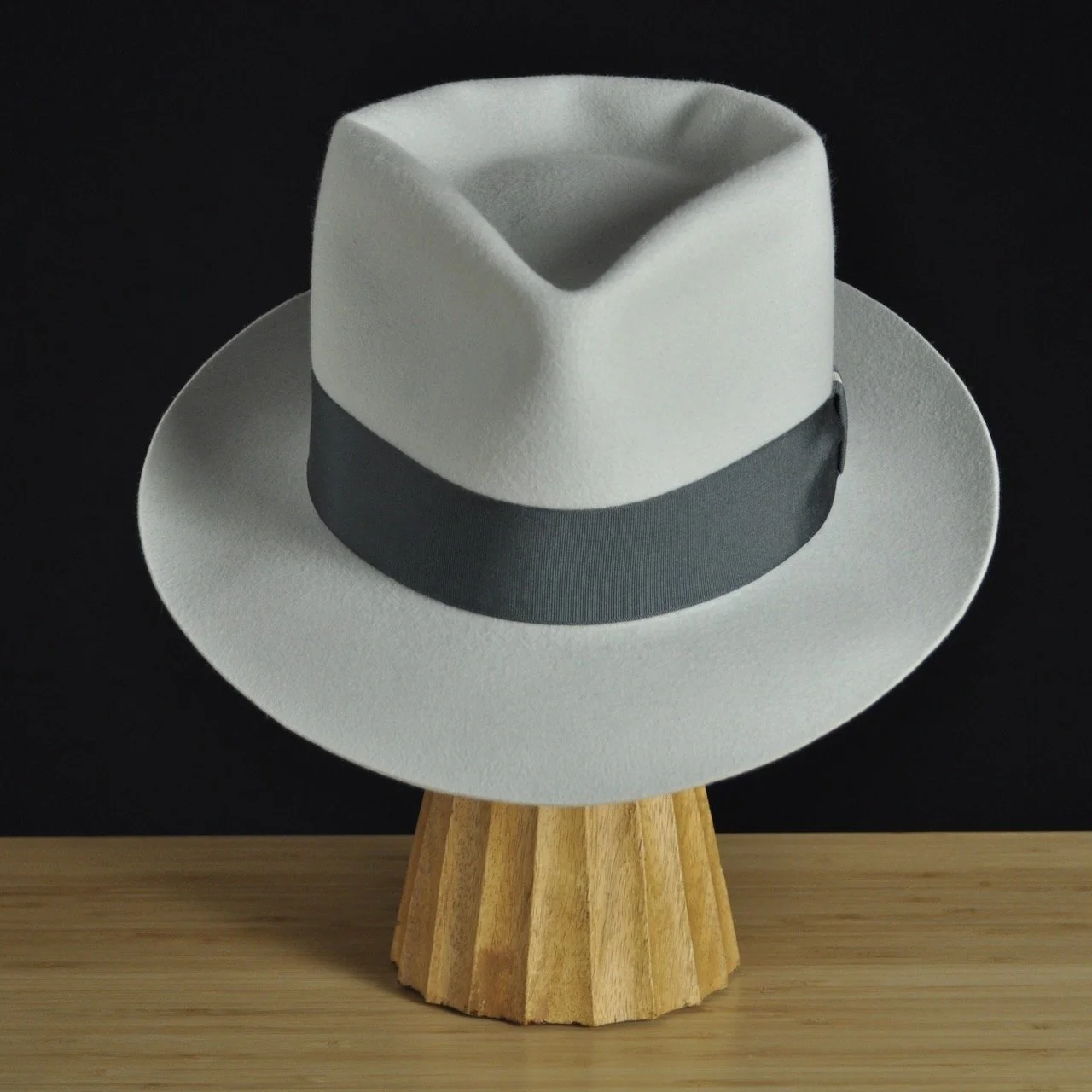 Front view of The Sunsetter silvermist felt fedora with a softly pinched crown, medium snap brim, and contrasting dark grosgrain ribbon with a modern tie (no bow).
