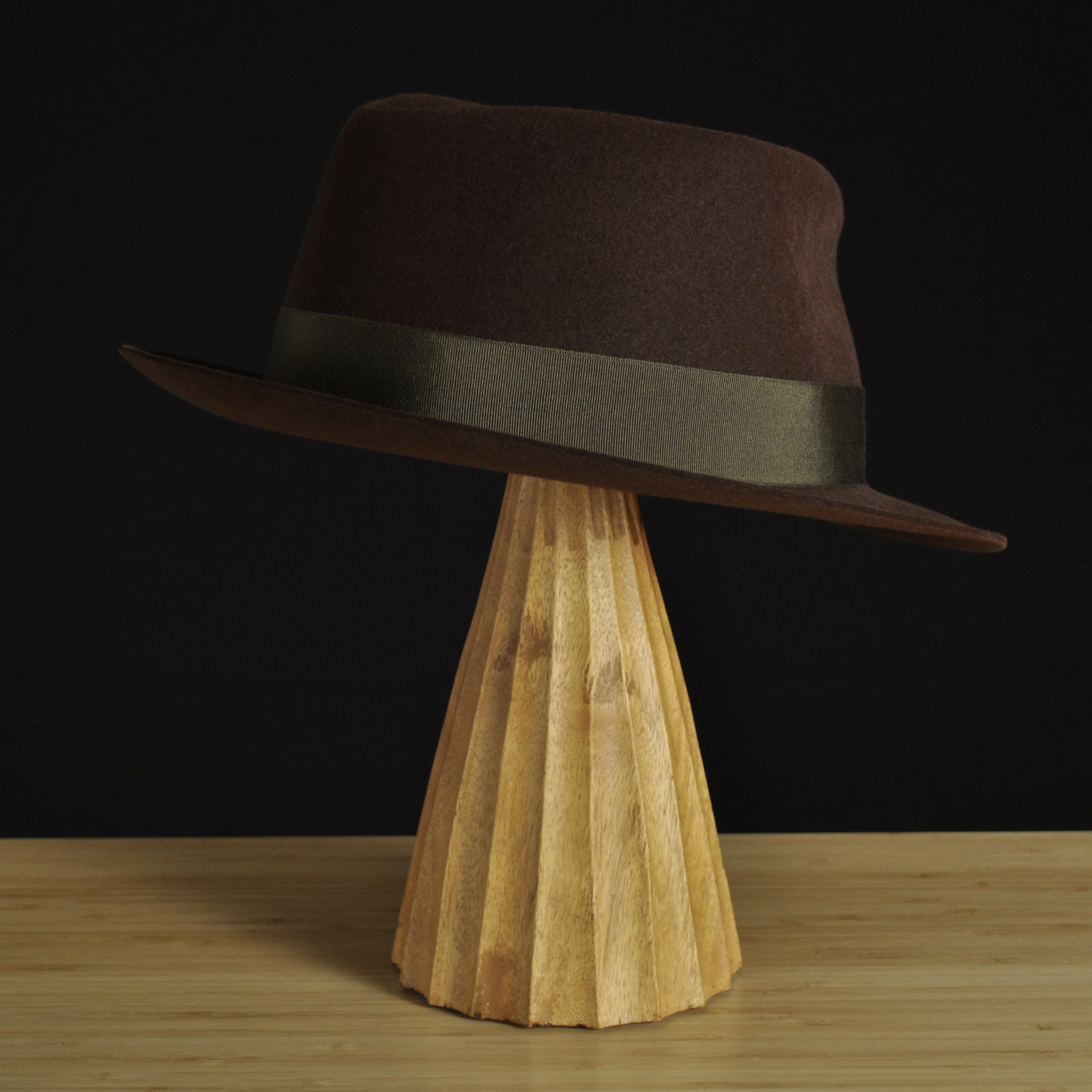 Three-quarter right back view of The Hielander brown felt fedora with a softly pinched crown, medium snap brim, and olive grosgrain ribbon with classic bow.