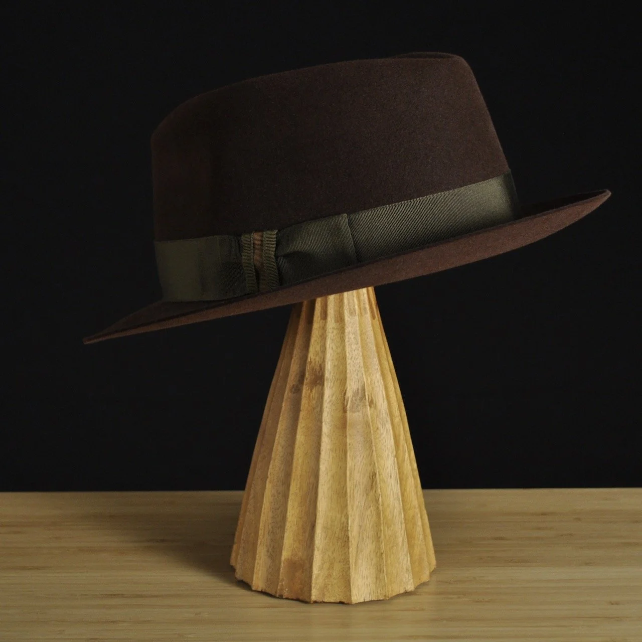 - Three quarter back left profile of The Hielander brown felt fedora highlighting the balanced proportions and subtle brim curvature.