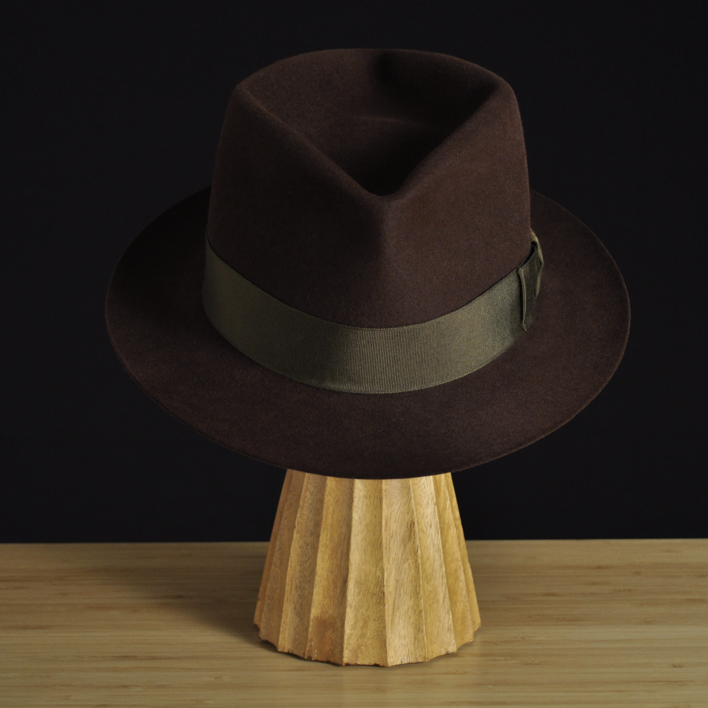 Front view of The Hielander brown felt fedora with a softly pinched crown, medium snap brim, and olive grosgrain ribbon with classic bow.