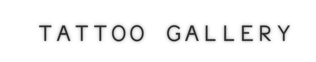 Sign reading 'Tattoo Gallery' in black text on a white background.