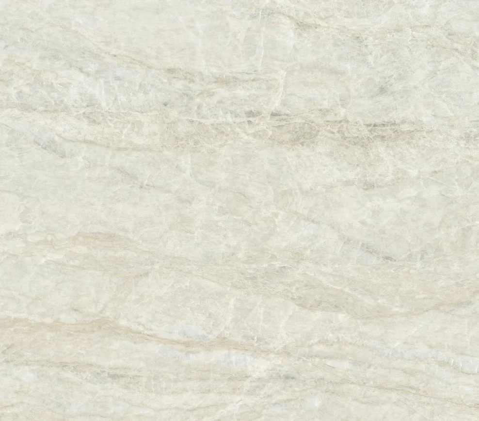 Close-up of a light-colored, textured stone or marble surface.