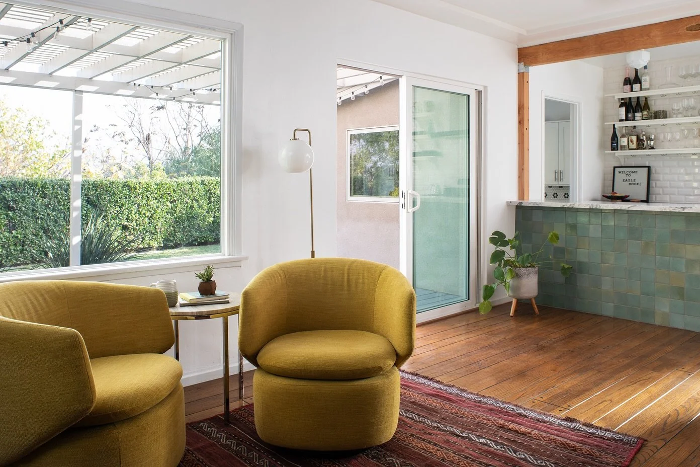 Less is more in our Eagle Rock Move in Refresh.  Larger openings are carved out of existing walls to bring light and air into the living spaces. Beautiful green gradients are mirrored from the backyard inside and reflected on the face of the new bar 