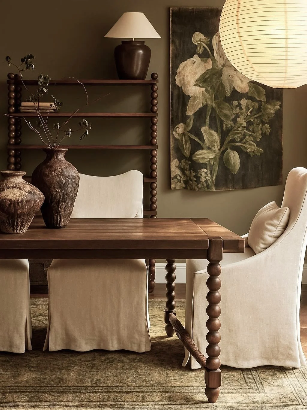 Loving this @bauwerkcolour paint colour as a moody backdrop to the stunning tapestry artwork. The @en._gold dining table, chairs and bookshelf are just exquisite! Also, I&rsquo;m buying myself this @cocorepublic lamp for Christmas. 

Design: @heritag