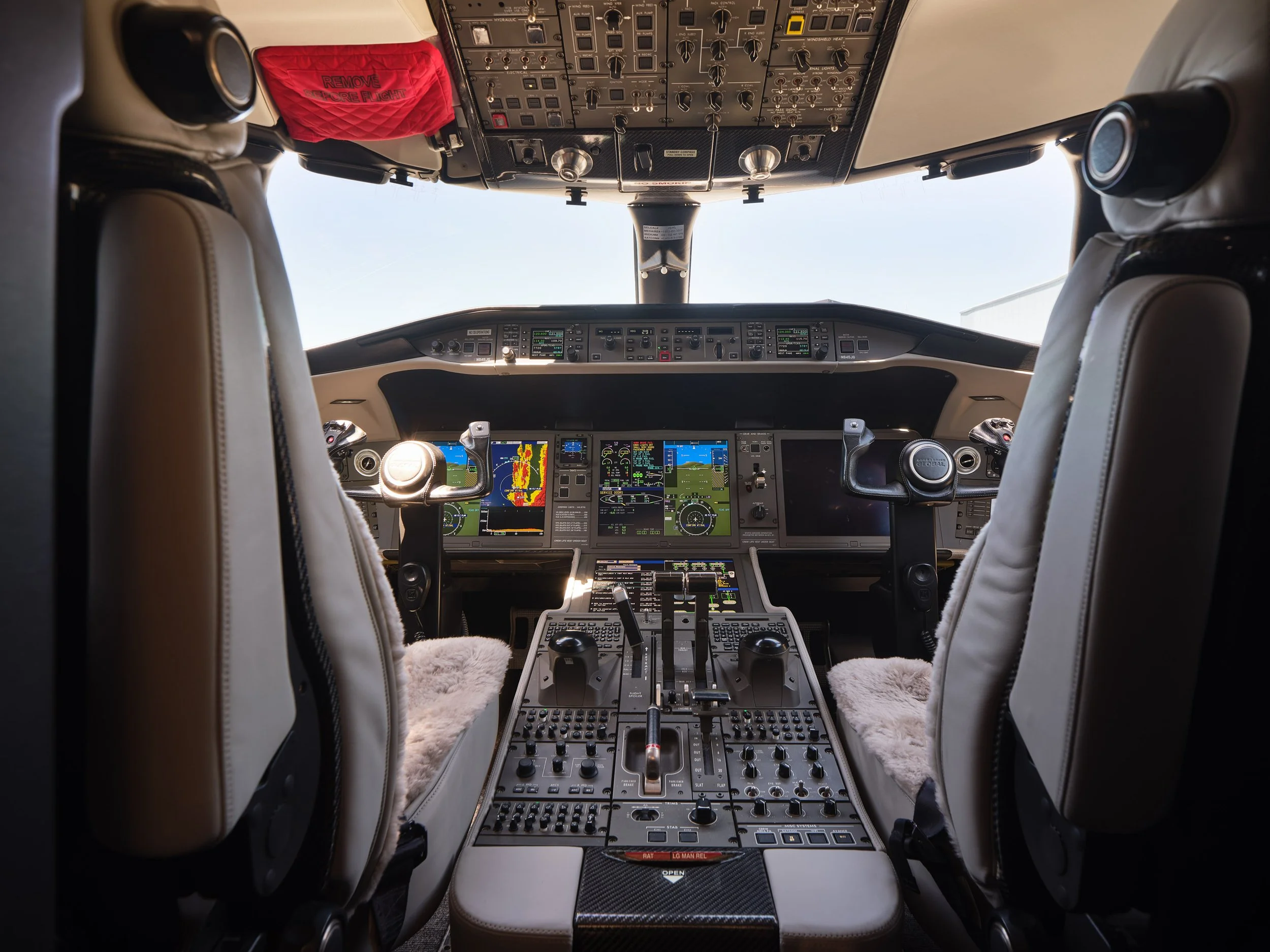 ACD | Alicia Cheung Design detailed this cockpit with plush grey sheepskin seat covers against the aircraft's original instrumentation, creating a playful and personal touch perfect for a client who spends serious time in the air.