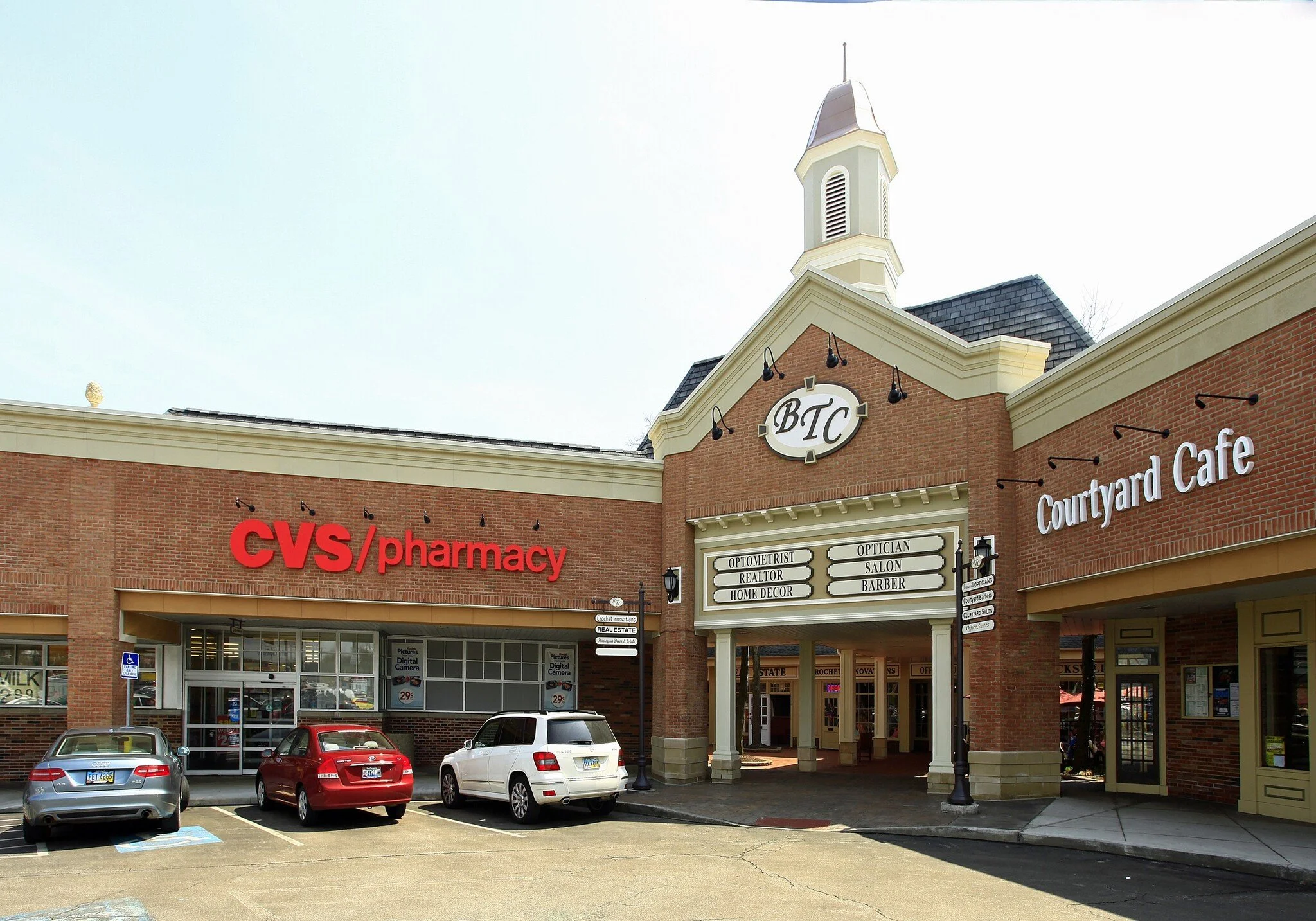 Brecksville town center plaza storefront and parking lot. In bewteeen to CVS and courtyard cafe.