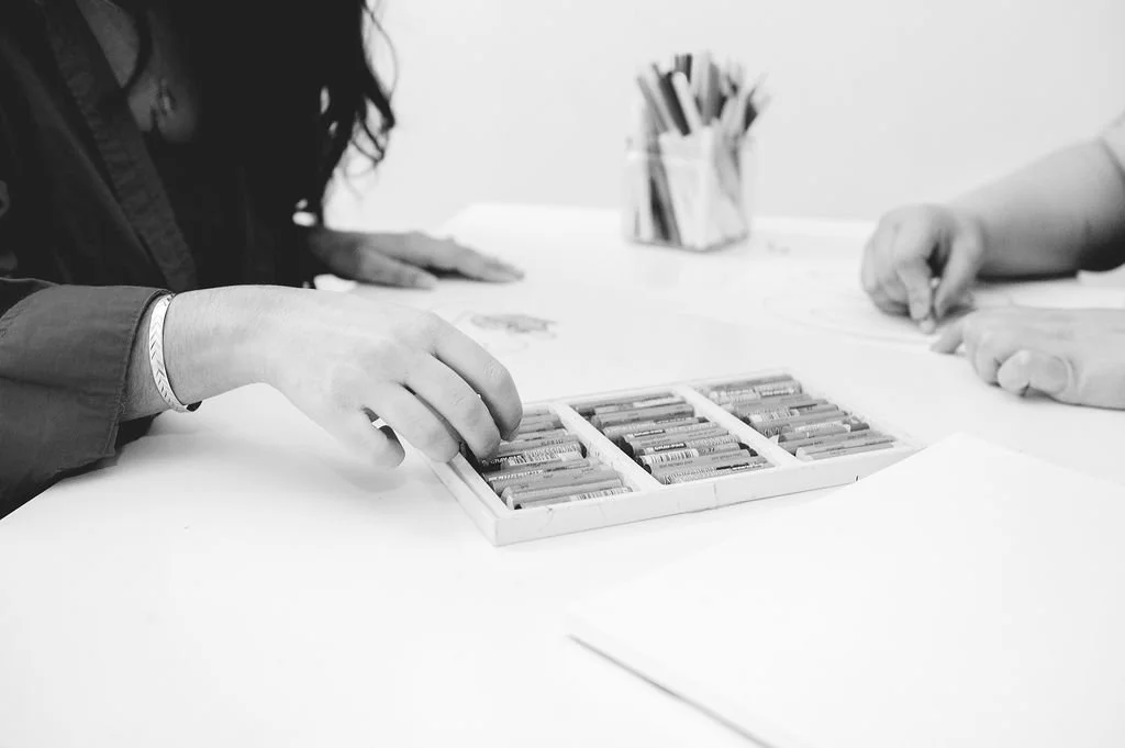 Woman Picking Up Oil Pastels For Art Therapy