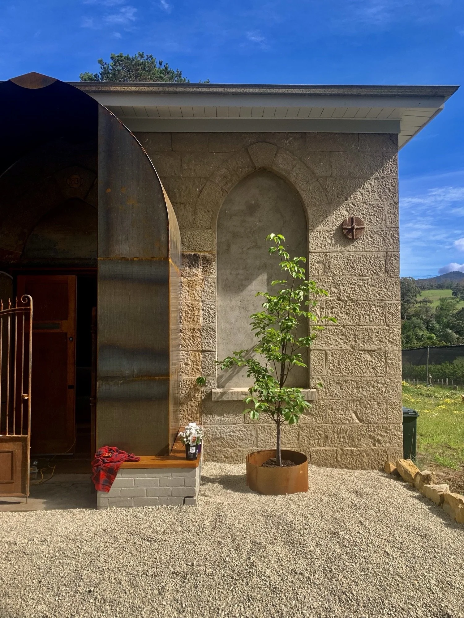 Corten steel front door awning before rusting process  has completed, at a private church in Southern Tasmania.