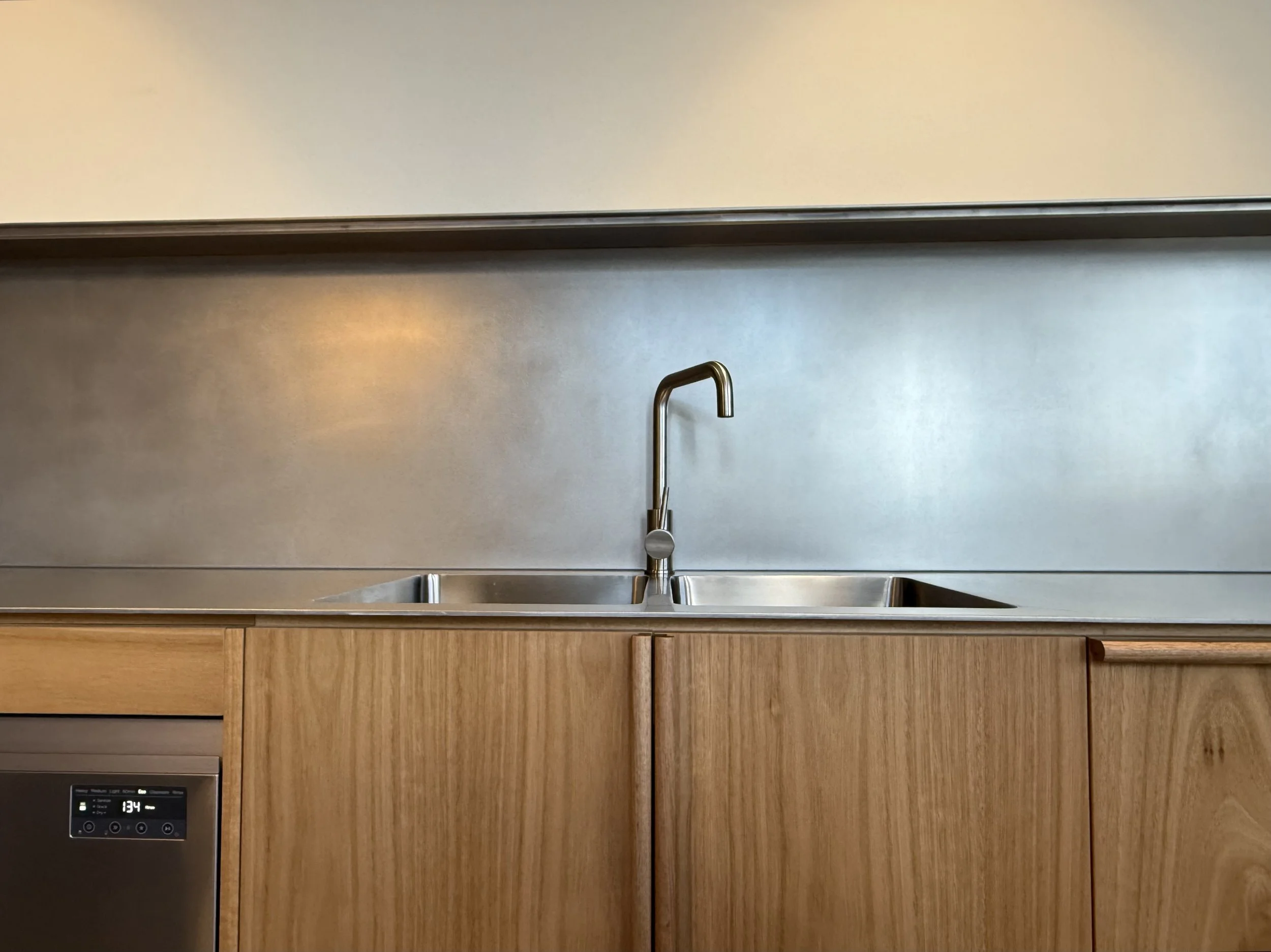 5mm Stainless Steel plate bench top with oscillated finish with integrated sinks,  installed in a private residence at Kingston.
