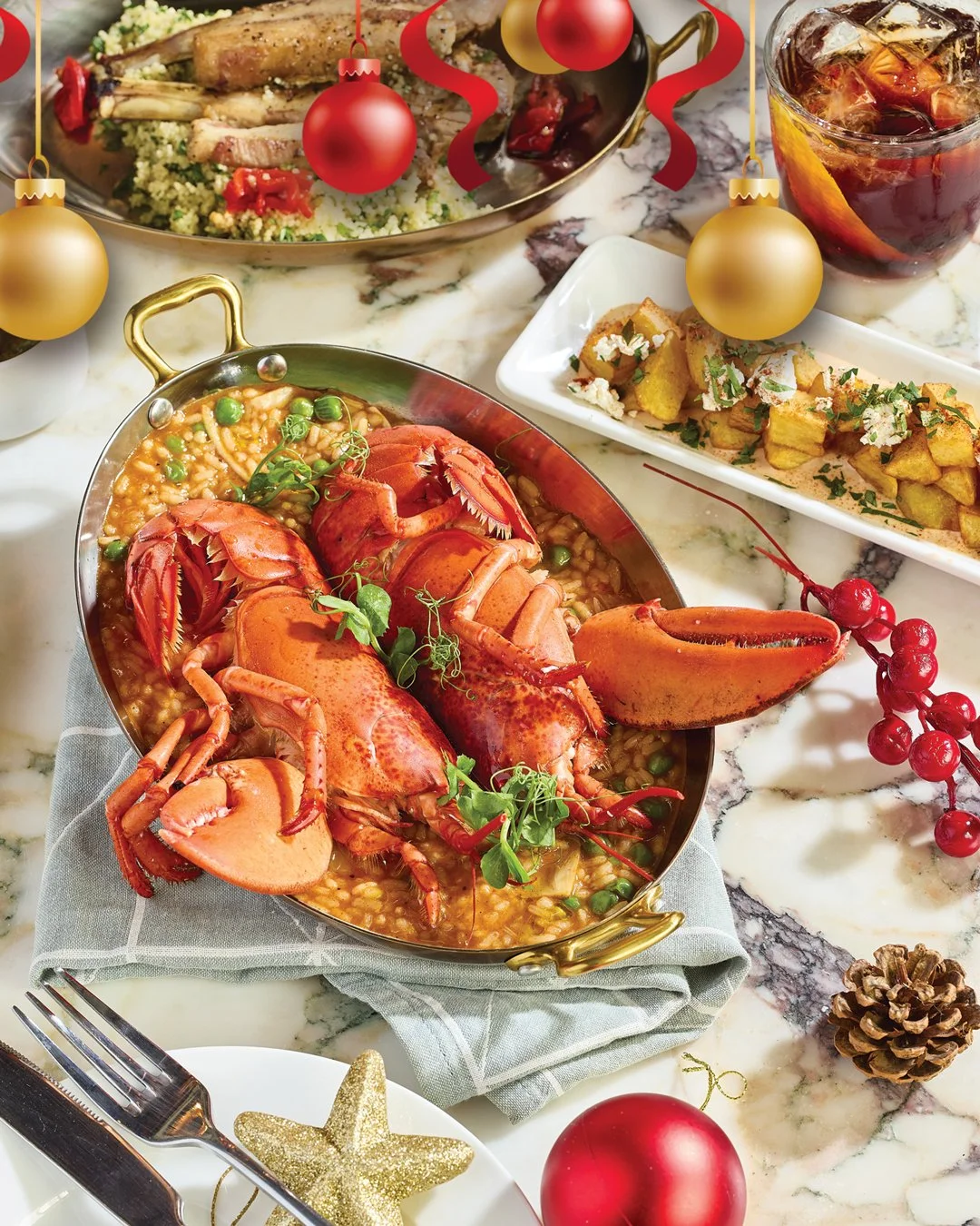 Lobster dish with herbs, surrounded by Christmas decorations and holiday-themed food and drinks on a marble table.
