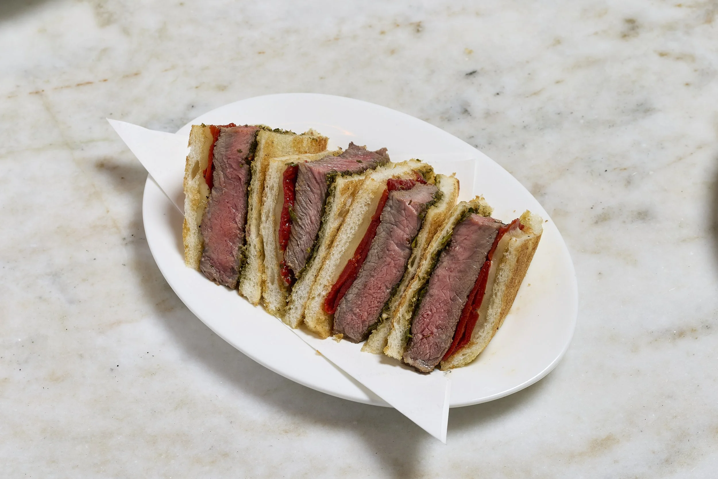 Beef Bikini  250g Ribeye, San Simon cheese, chimichurri
牛排比基尼三文治, 白樺木煙燻芝士, 香草醬
