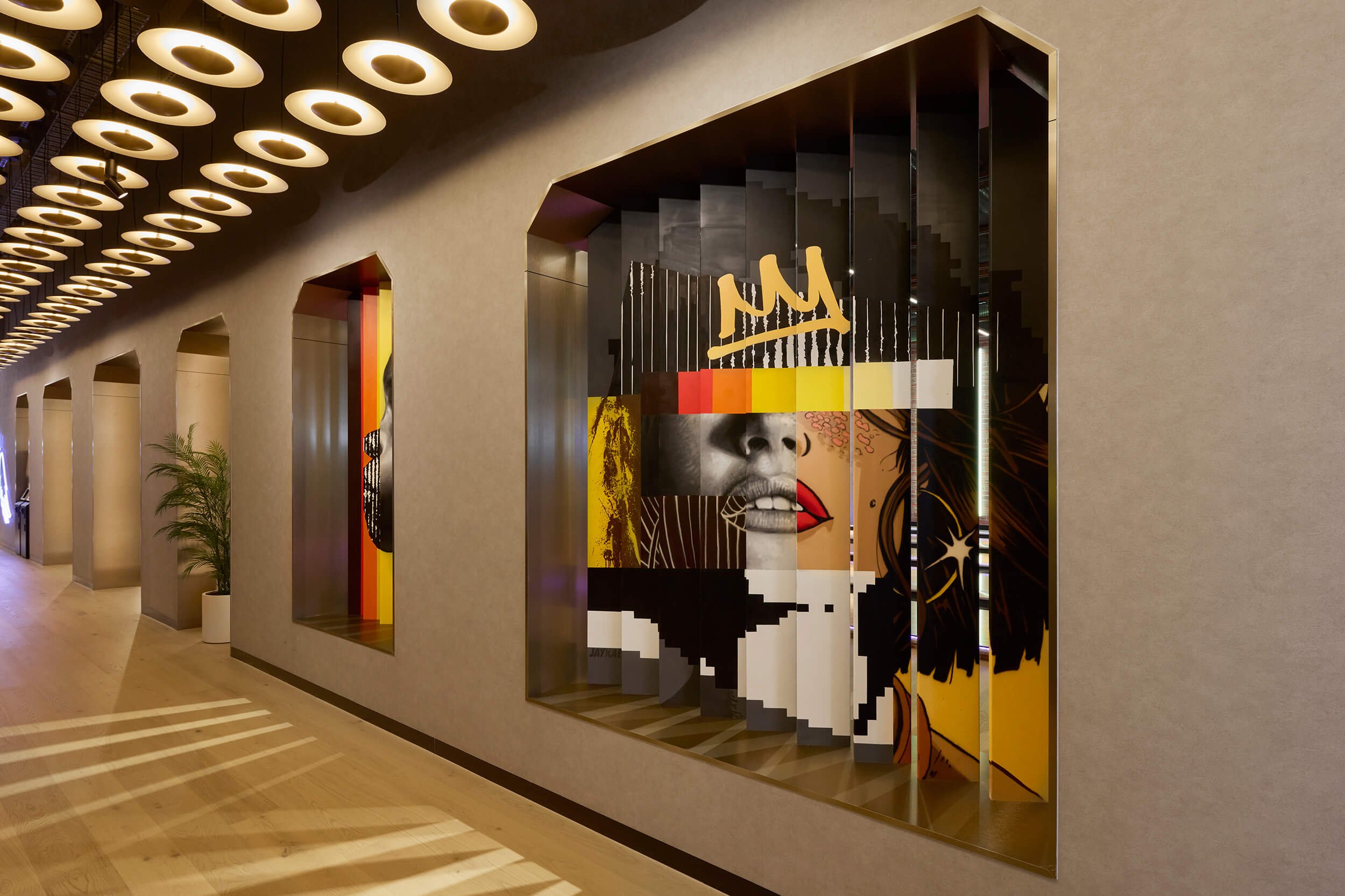 anamorhpic mural on slat wall in underground entertainment venue