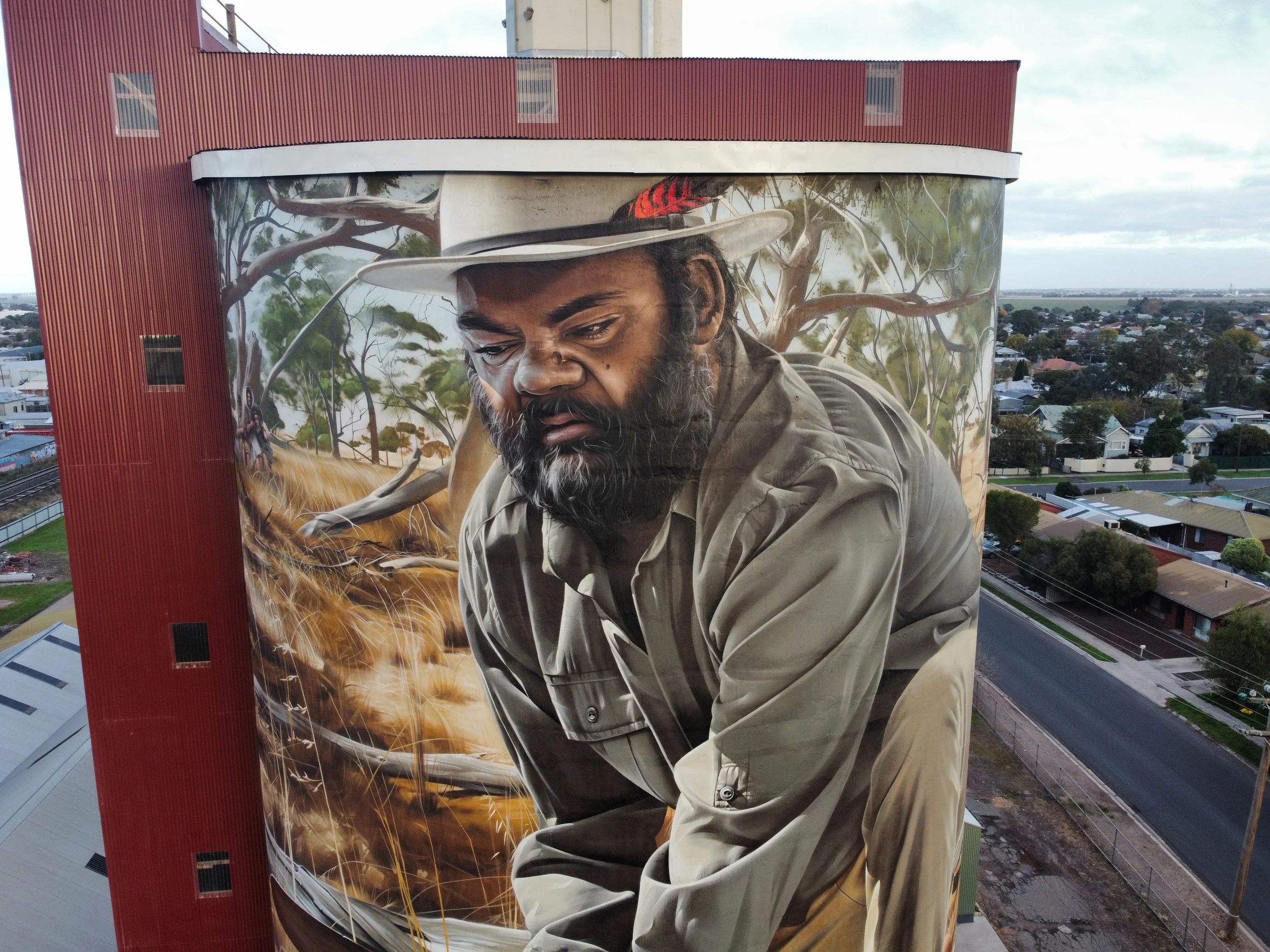 an image of a mural on a silo by smug