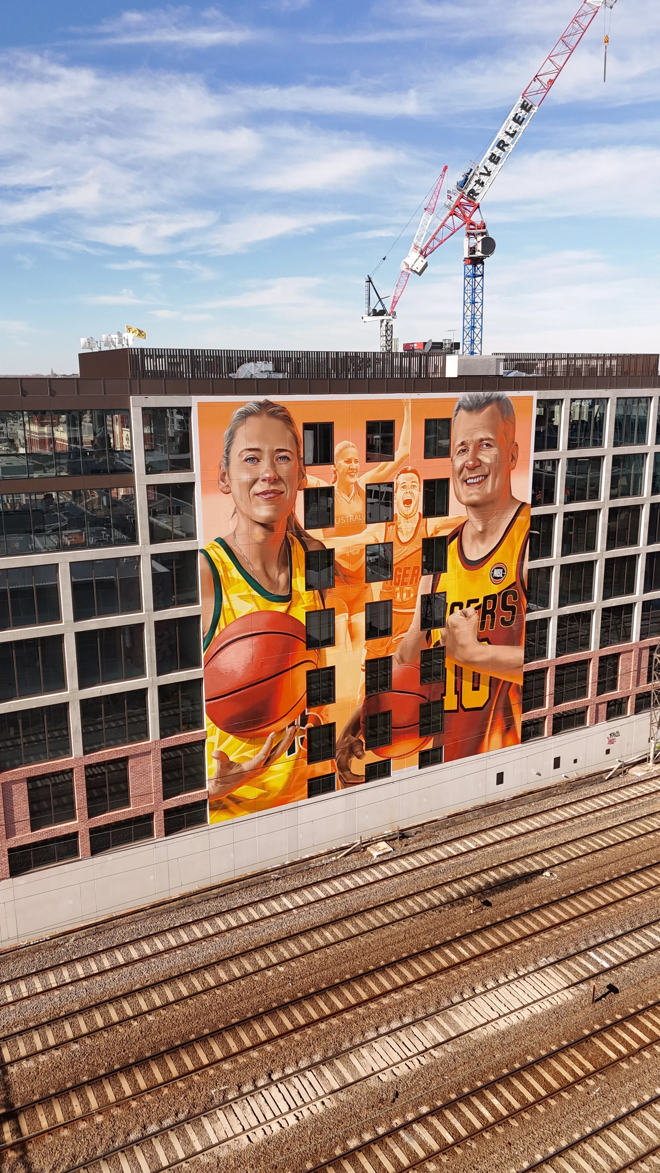 a mural depicting basketball players lauren jackson and andrew gaze