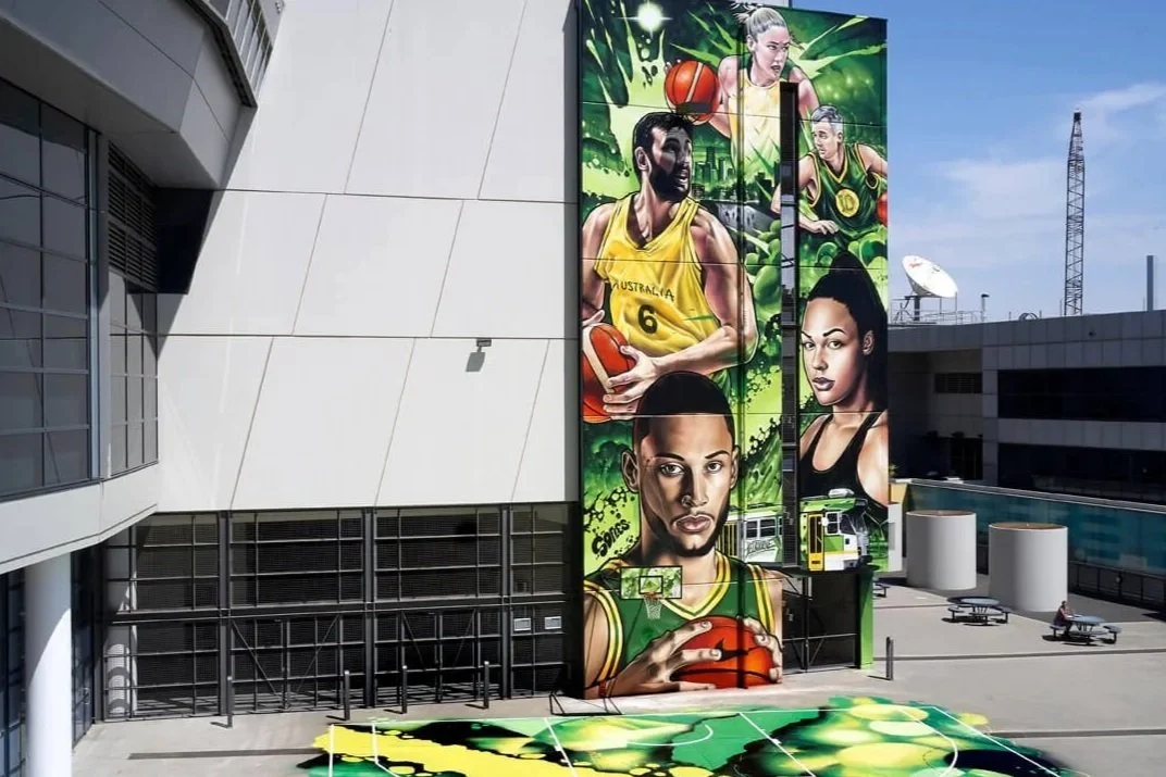 large scale street art mural of nbl stars and painted basketball court