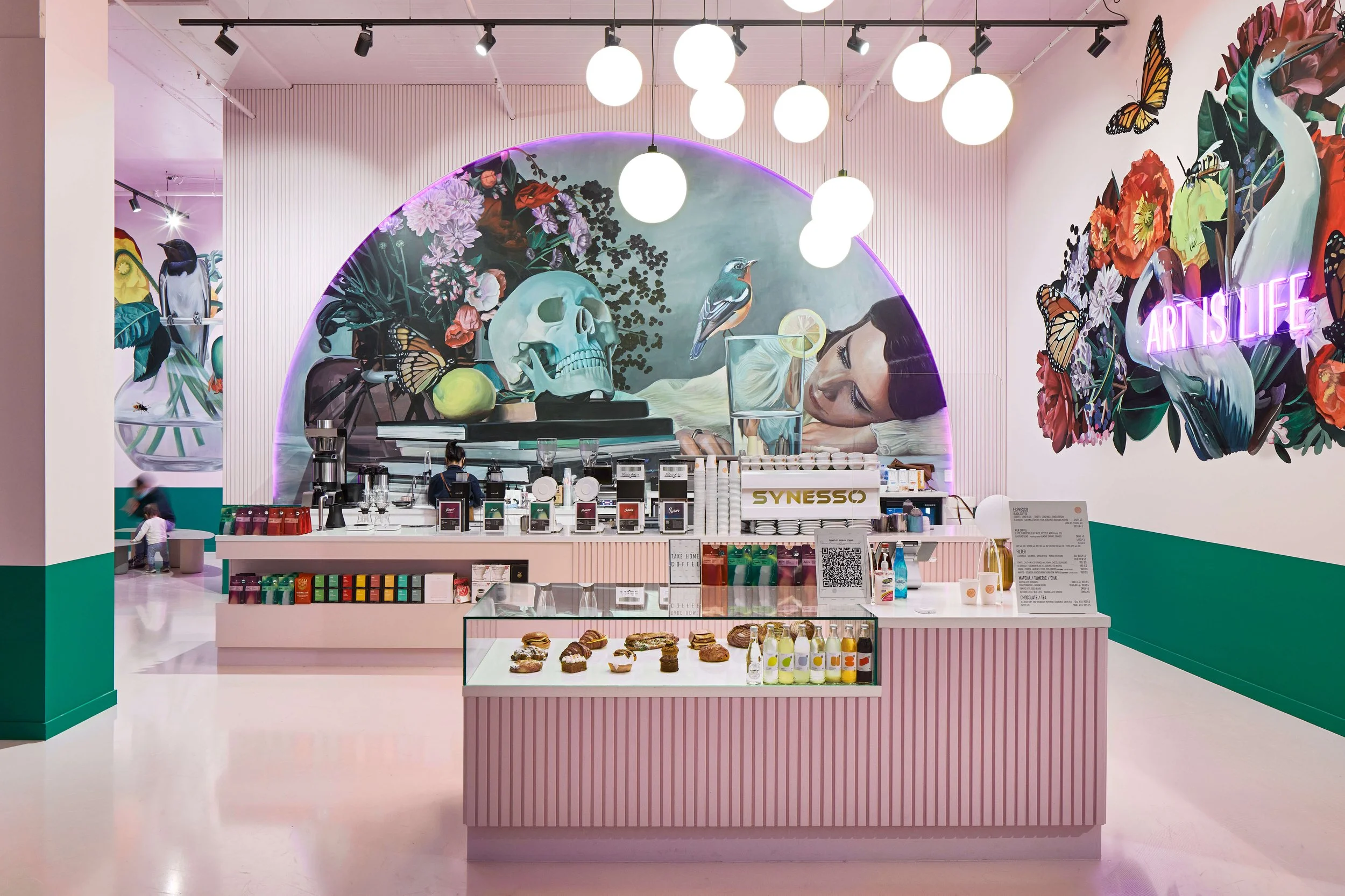 mural depeicting a woman contemplative expression cafe