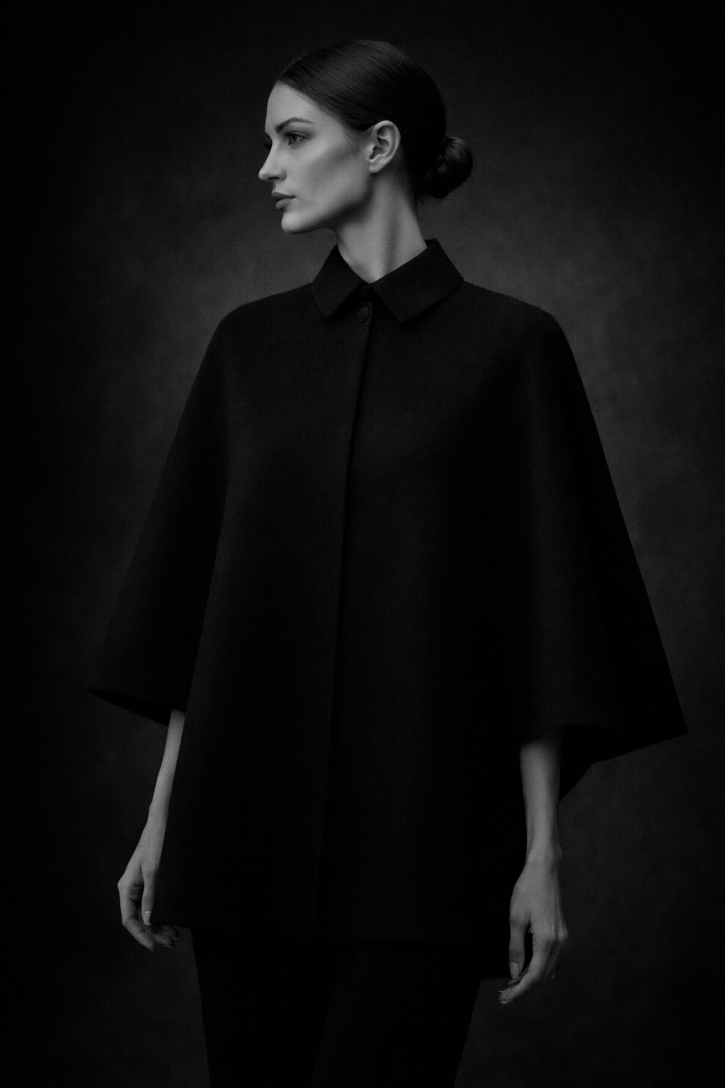Model wearing the Castellaines Eloise cape, studio portrait