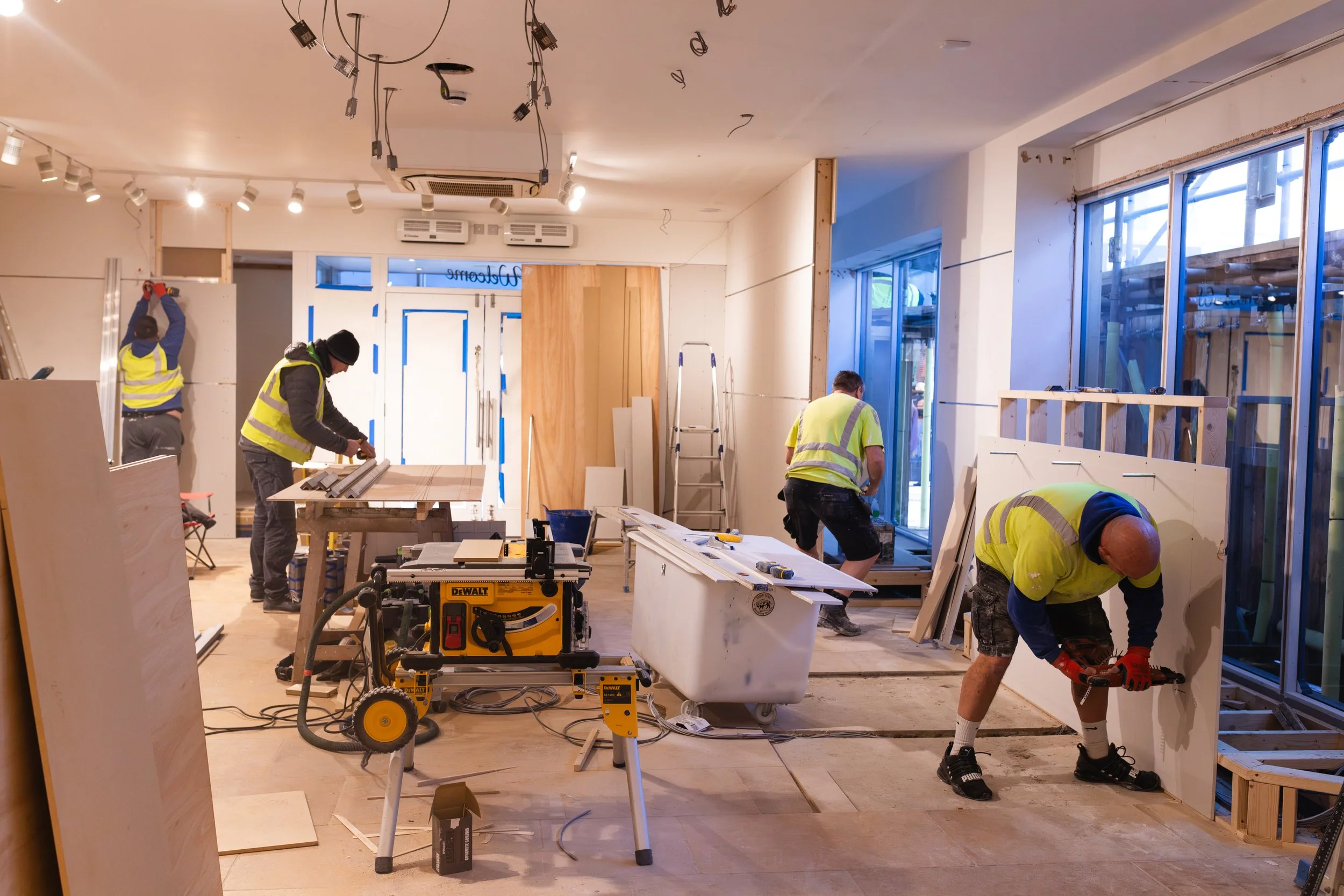 The team at REN Contractors on site inside doing various jobs