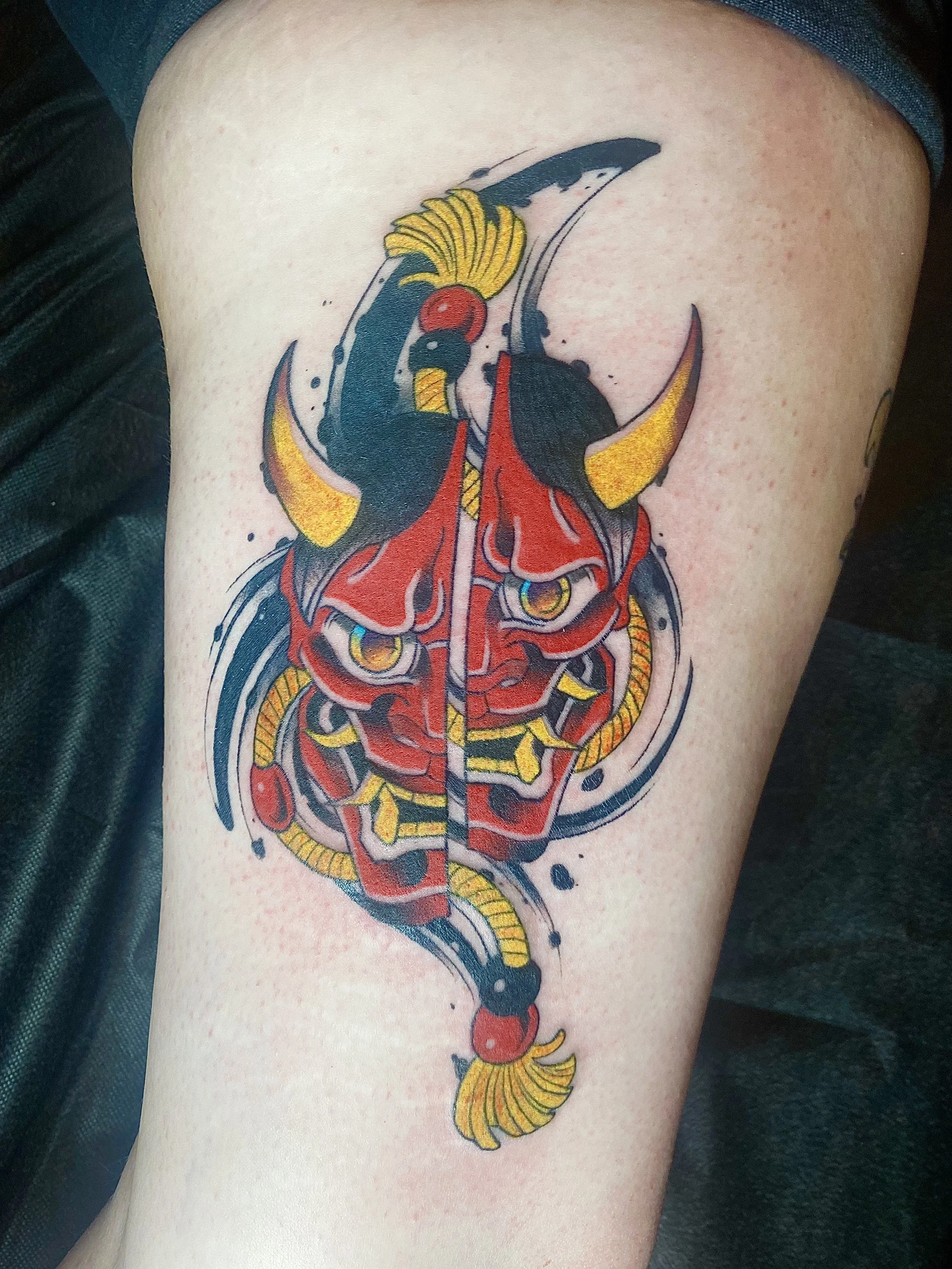 American Traditional-inspired hanya with abstract black and psychedelic elements by Denver tattoo artist Joshua Socrates in RiNo.
