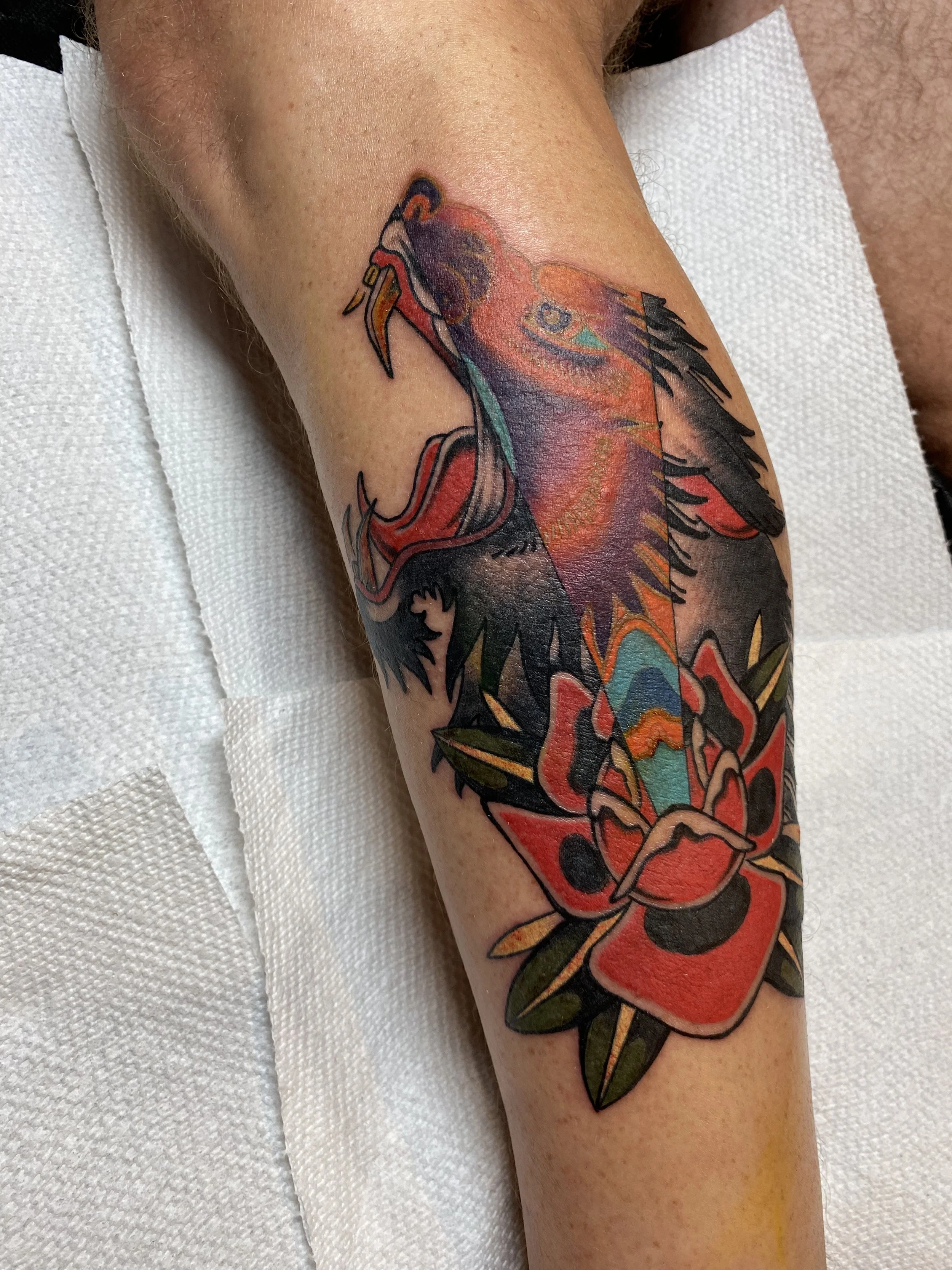 American Traditional-inspired wolf tattoo with psychedelic elements by Denver tattoo artist Joshua Socrates in RiNo.