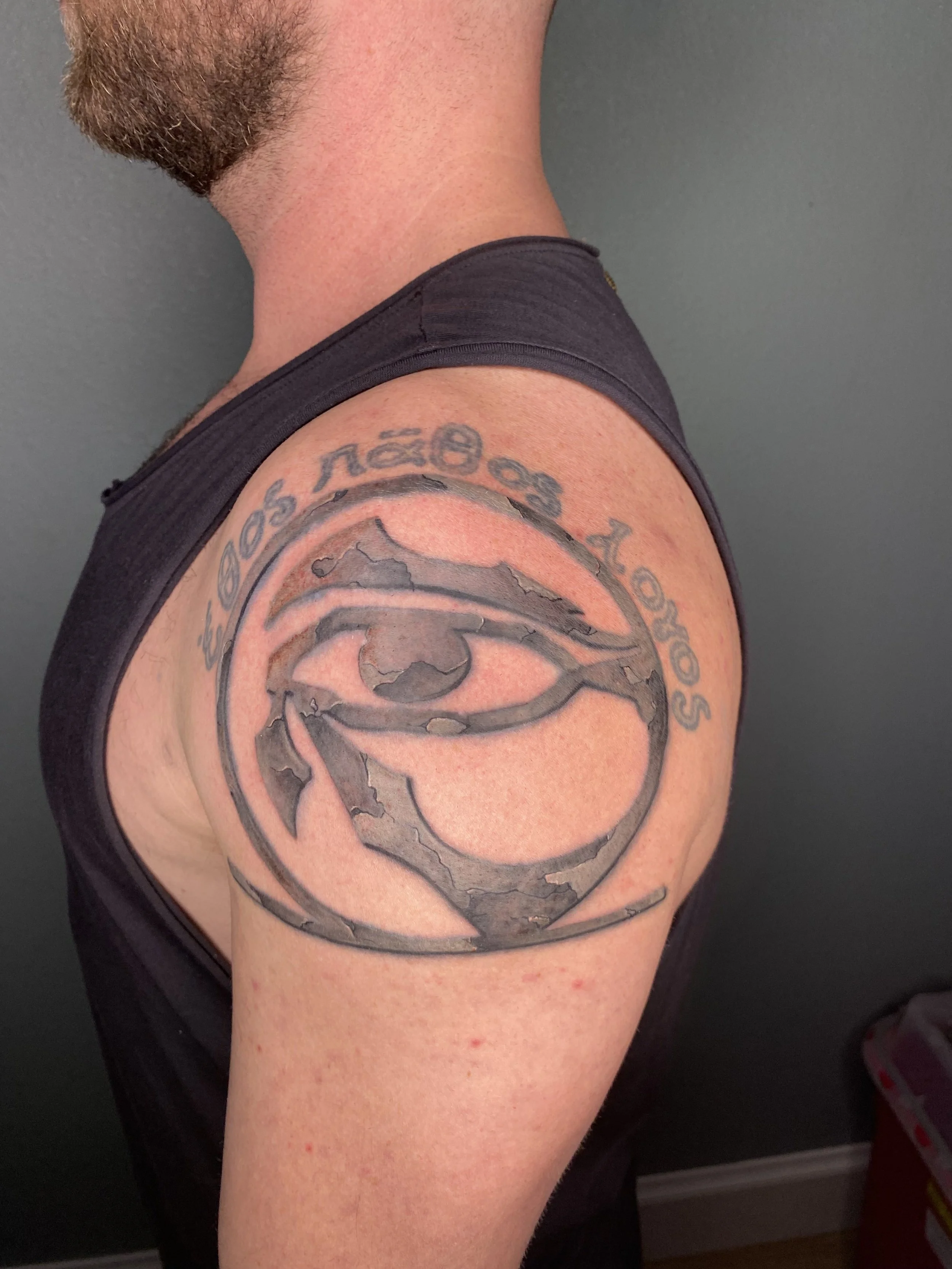 Rework of a black and grey tattoo with opaque greys to create a stone texture