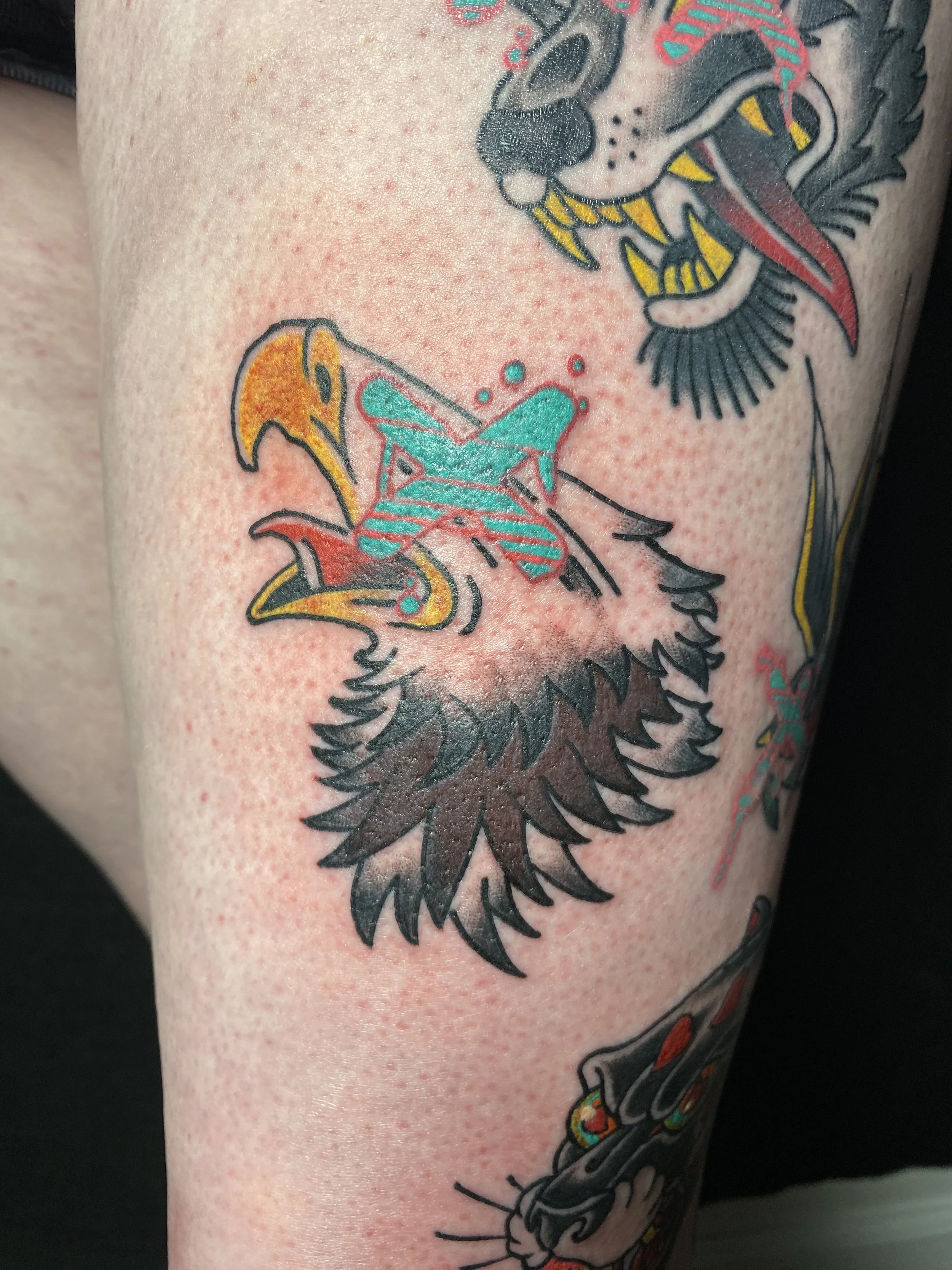 American Traditional color eagle tattoo with psychedelic elements by Denver tattoo artist Joshua Socrates in RiNo.