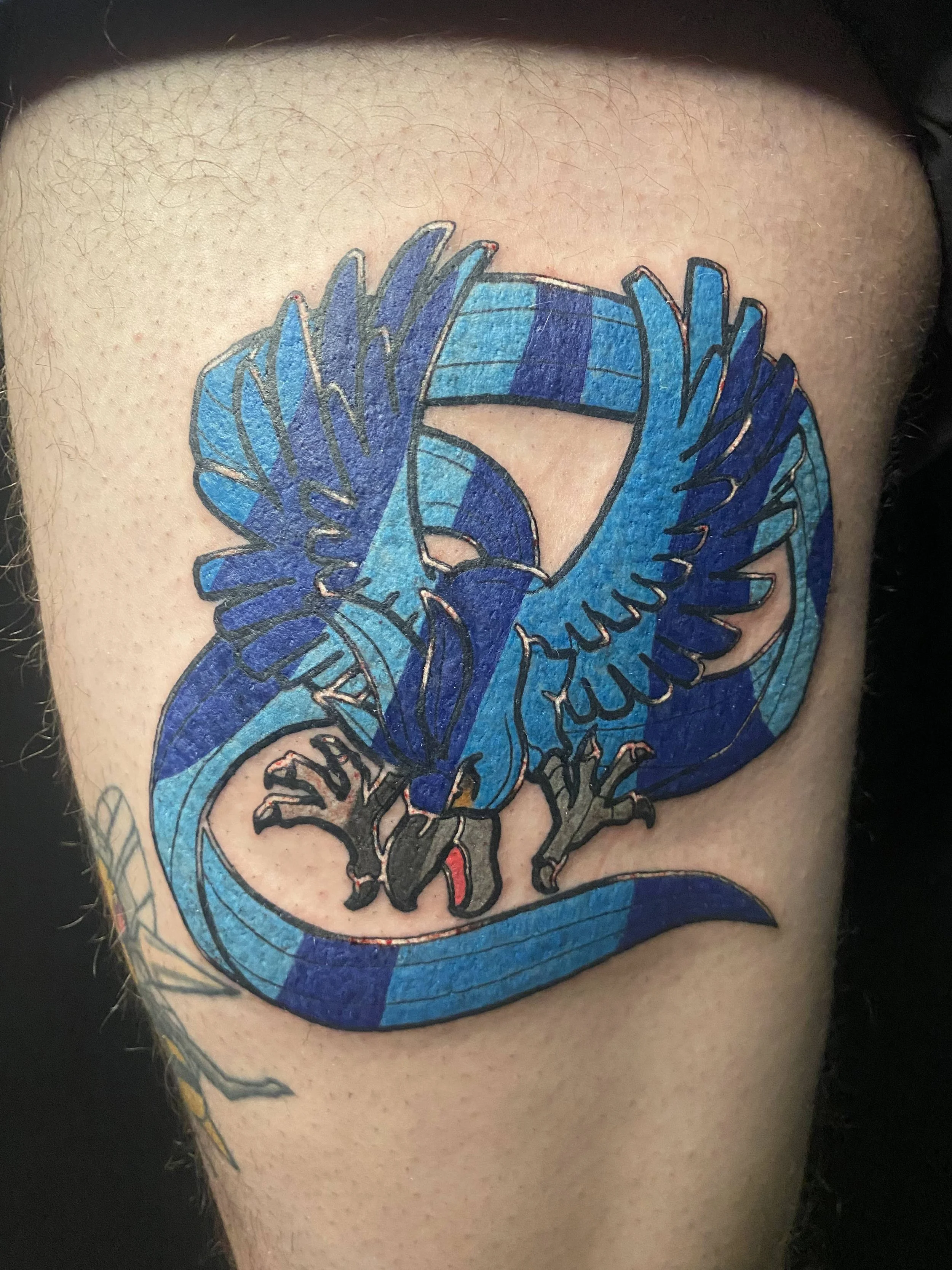 Articuno Pokemon tattoo in a stained glass style