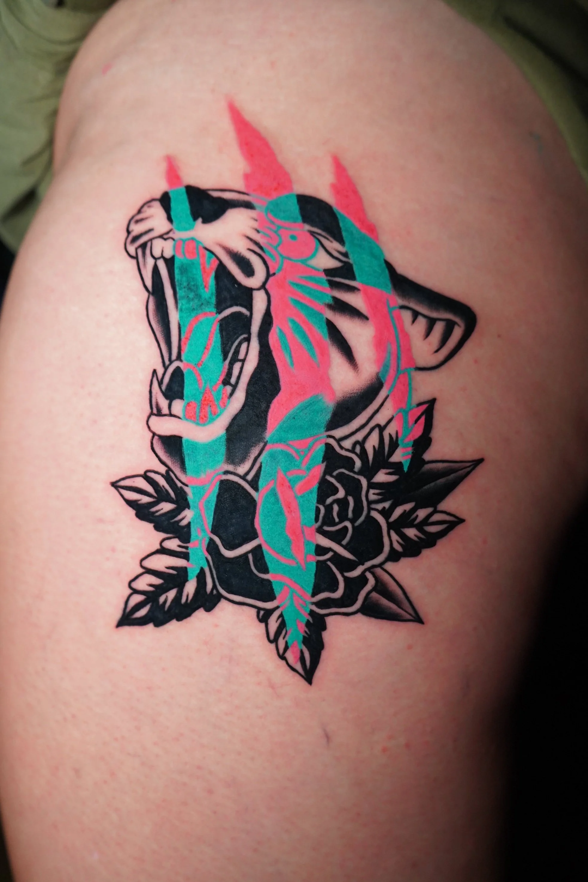 American traditional panther tattoo with jagged inverted pink and teal streaks. Saturated color, vibrant color