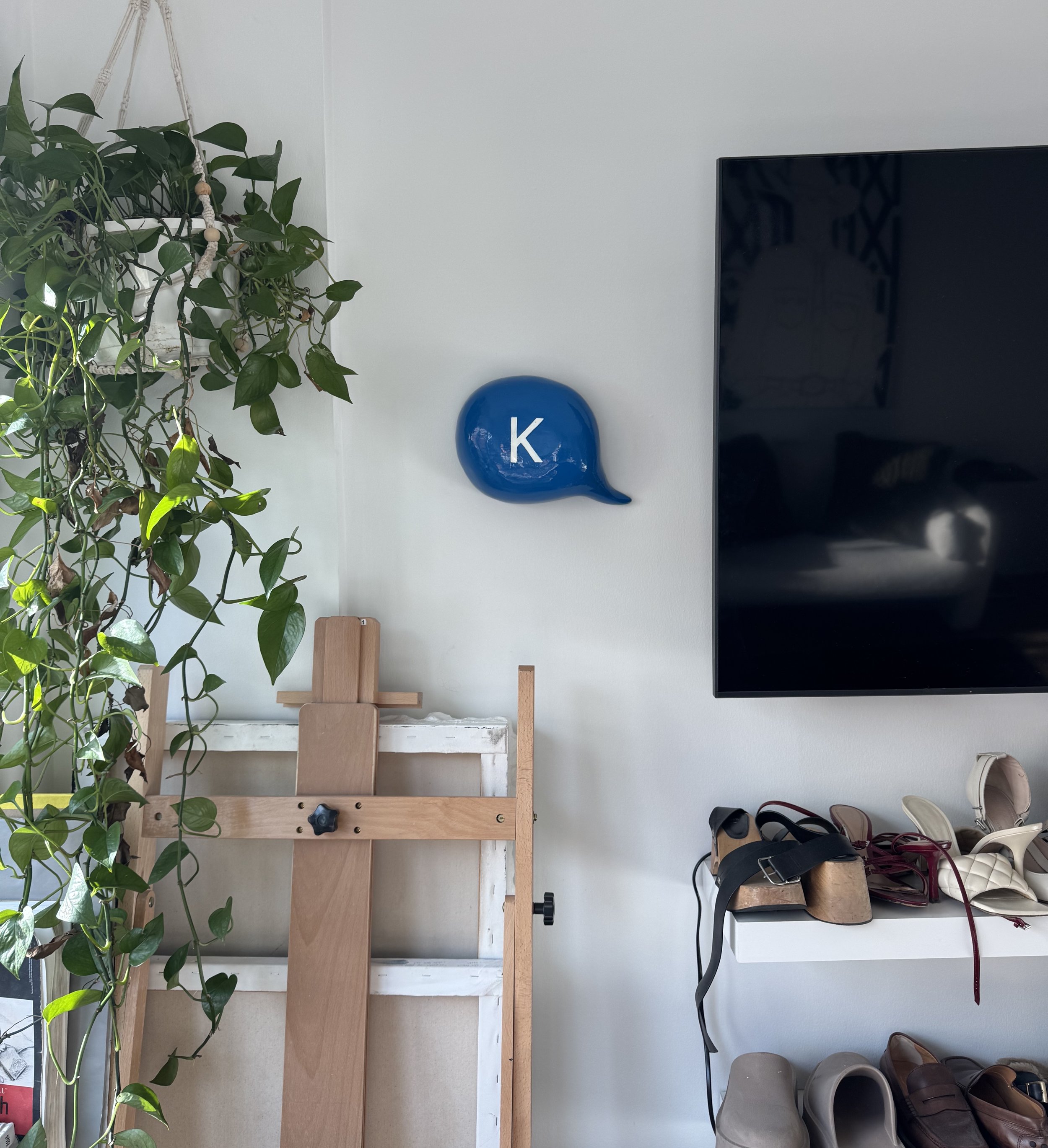 Ceramic speech bubble sculpture with modern minimalist design and humorous text, perfect for home or office decor.