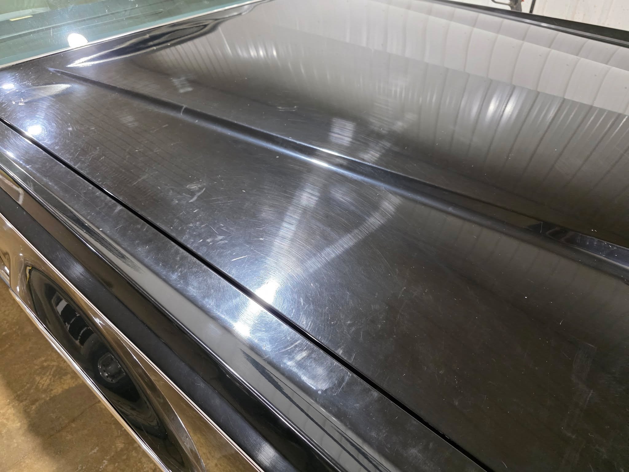 See those circular marks? That's what automated car washes do to your paint. Every pass. Every visit.

They're called swirl marks &mdash; microscopic scratches in your clear coat from dirty brushes and aggressive materials dragging across your paint.